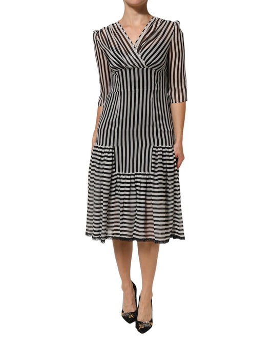 A black and white striped midi dress with a V-neck