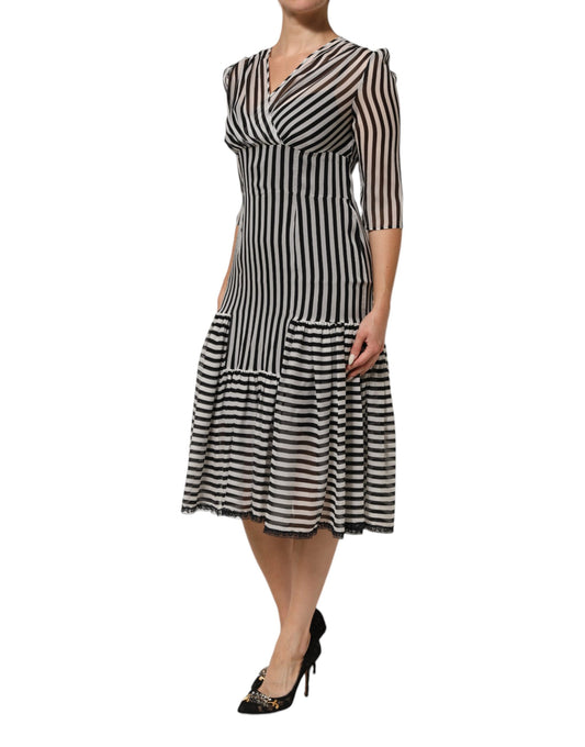 A black and white striped midi dress with a V-neck