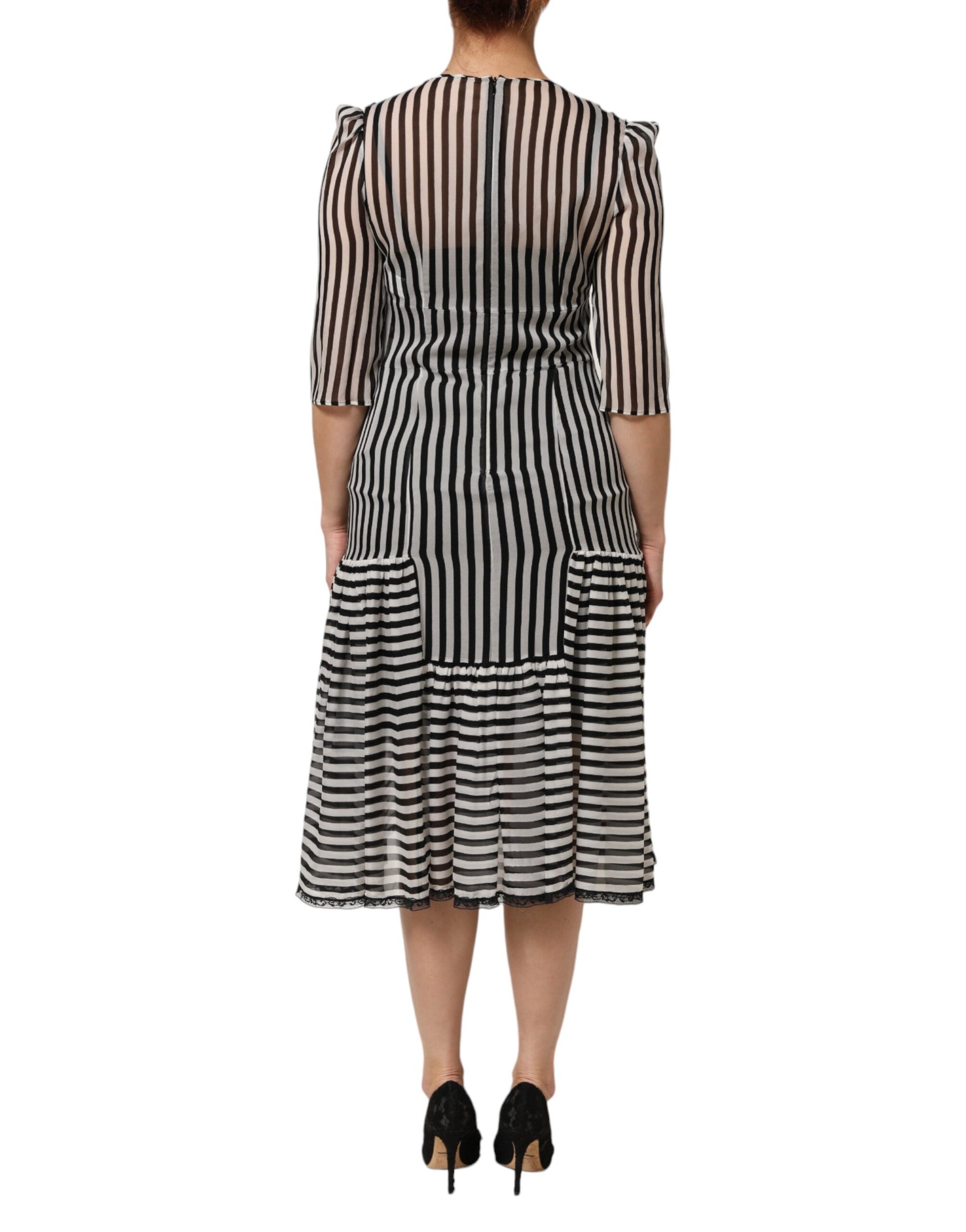 A black and white striped midi dress with a V-neck