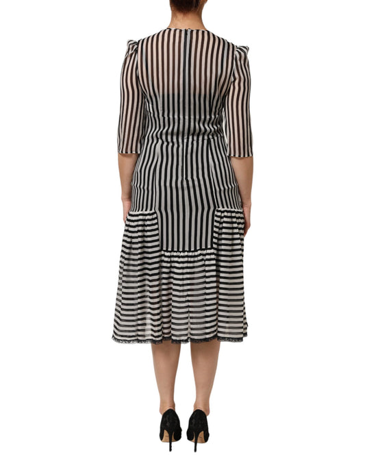 A black and white striped midi dress with a V-neck