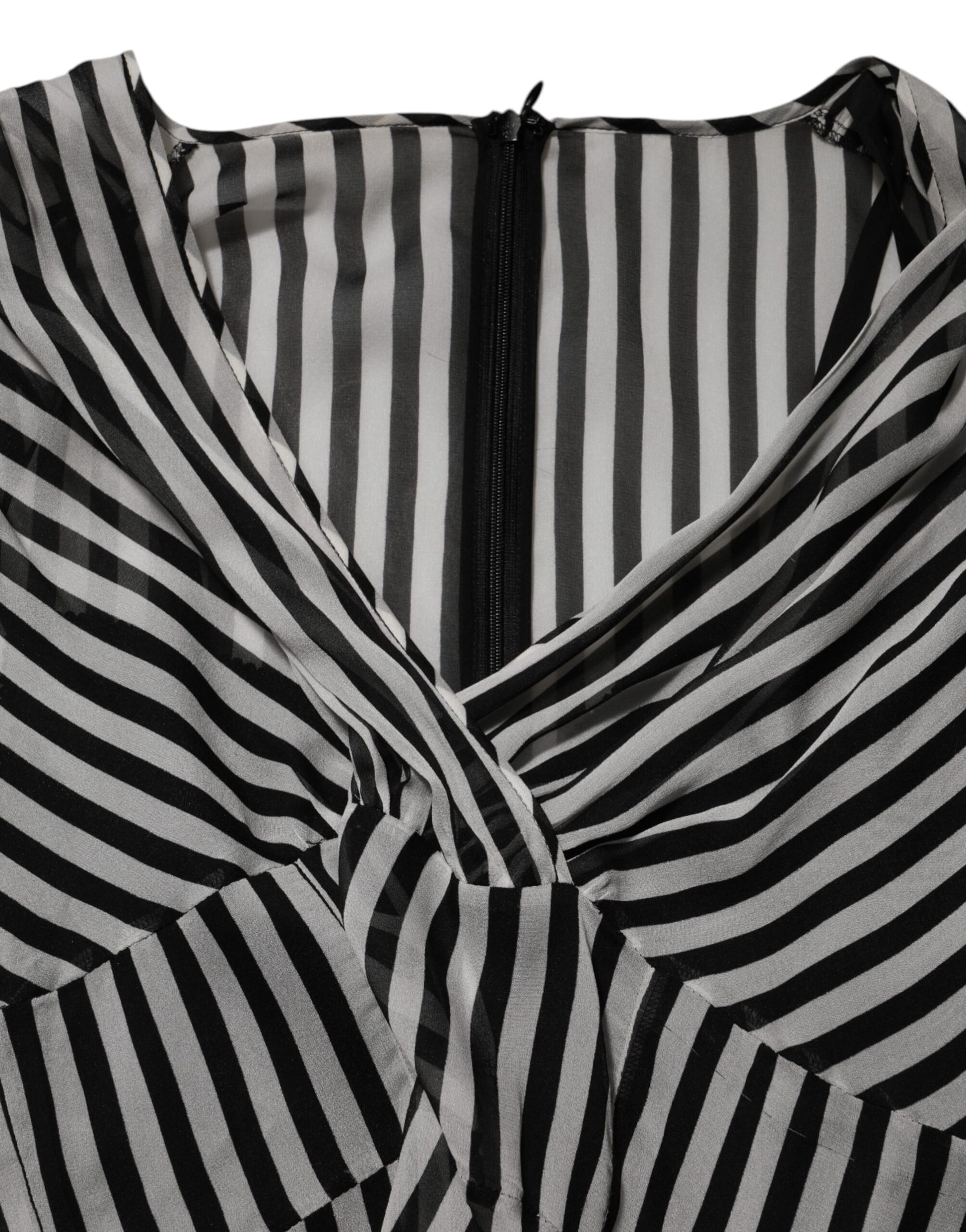 A black and white striped silk midi dress with a V-neck