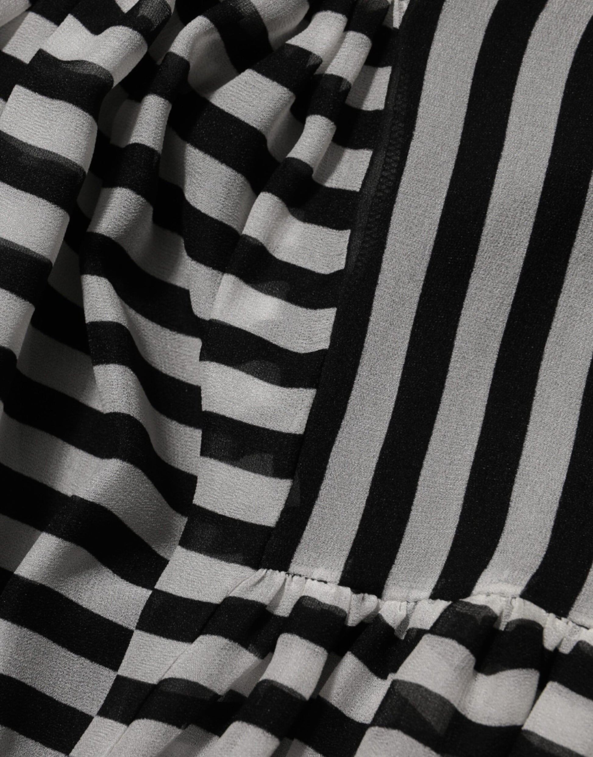 A black and white striped midi dress with a V-neck