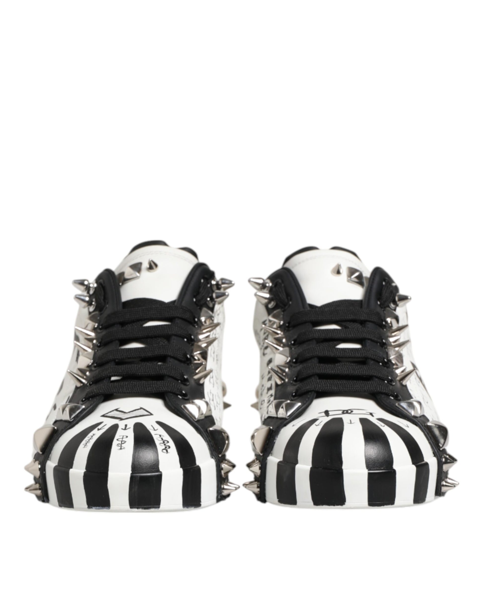 Pair of black and white studded low top sneakers with laces, designed by Dolce & Gabbana