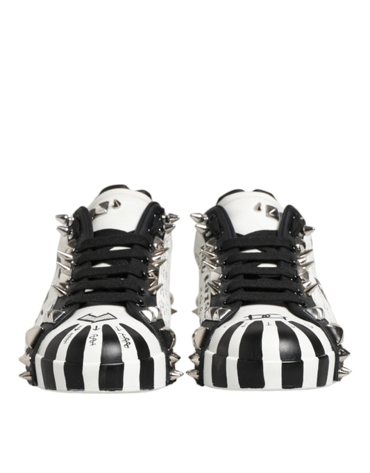 Pair of black and white studded low top sneakers with laces, designed by Dolce & Gabbana