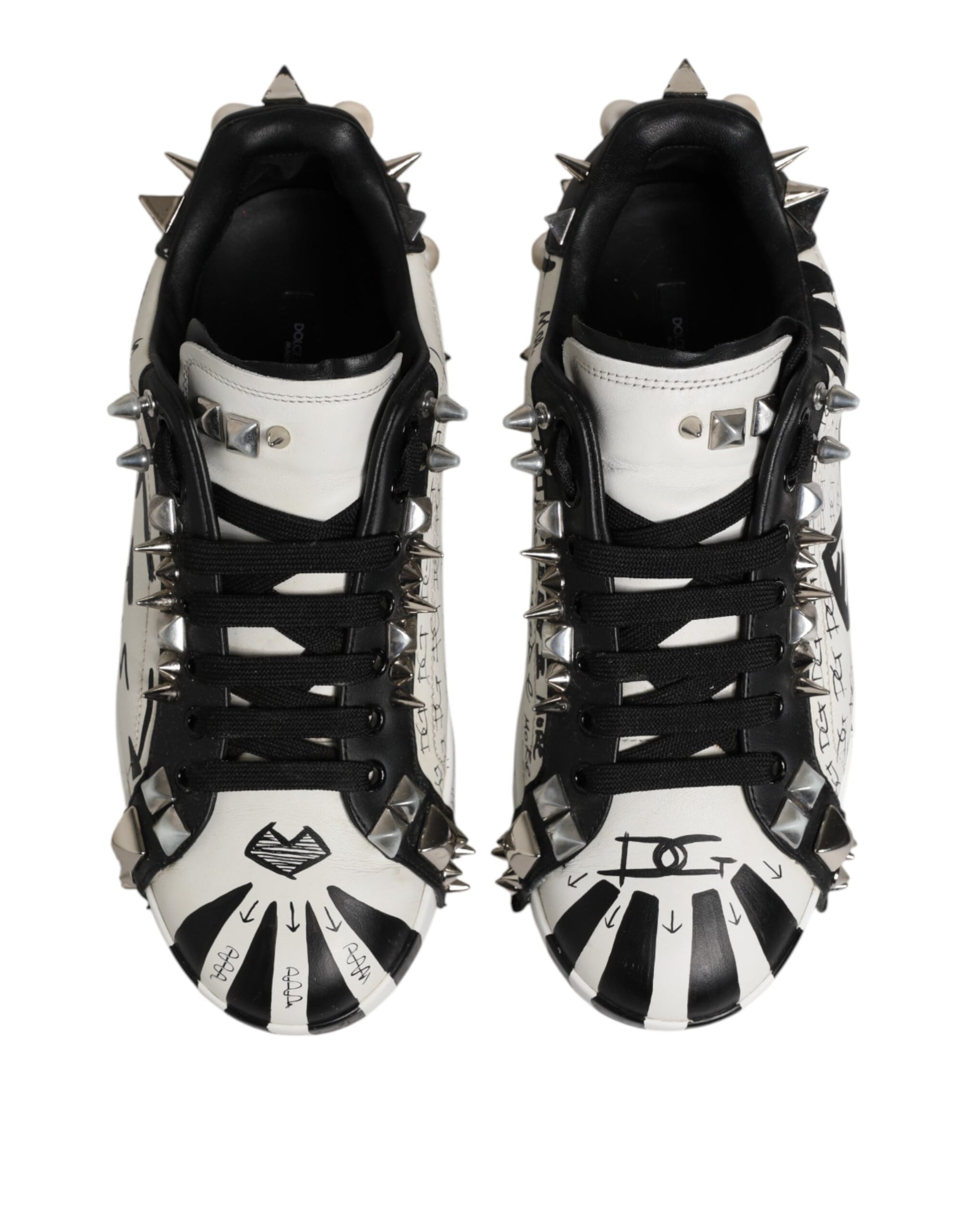 Pair of black and white studded low top sneakers with D&G logo on side
