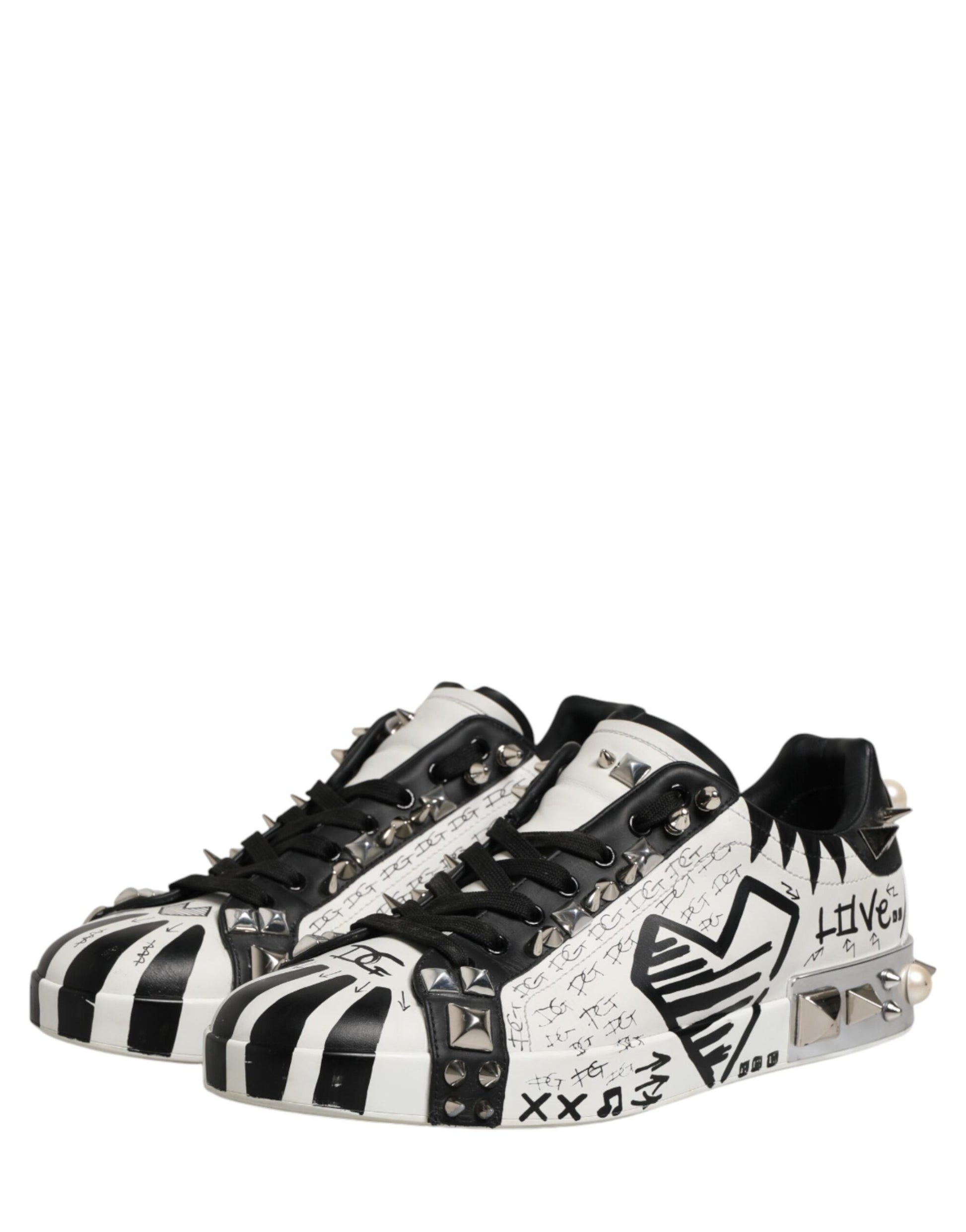 Black and white sneakers with spikes on sides