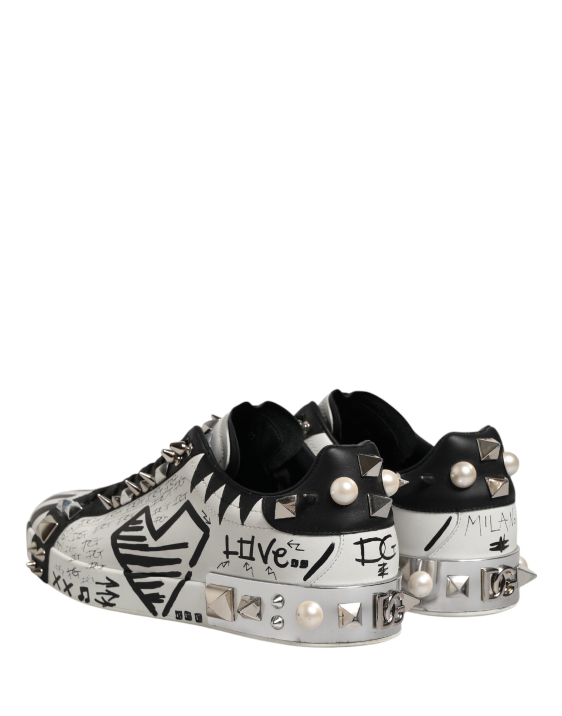 Black and white sneakers with studs and writing on them