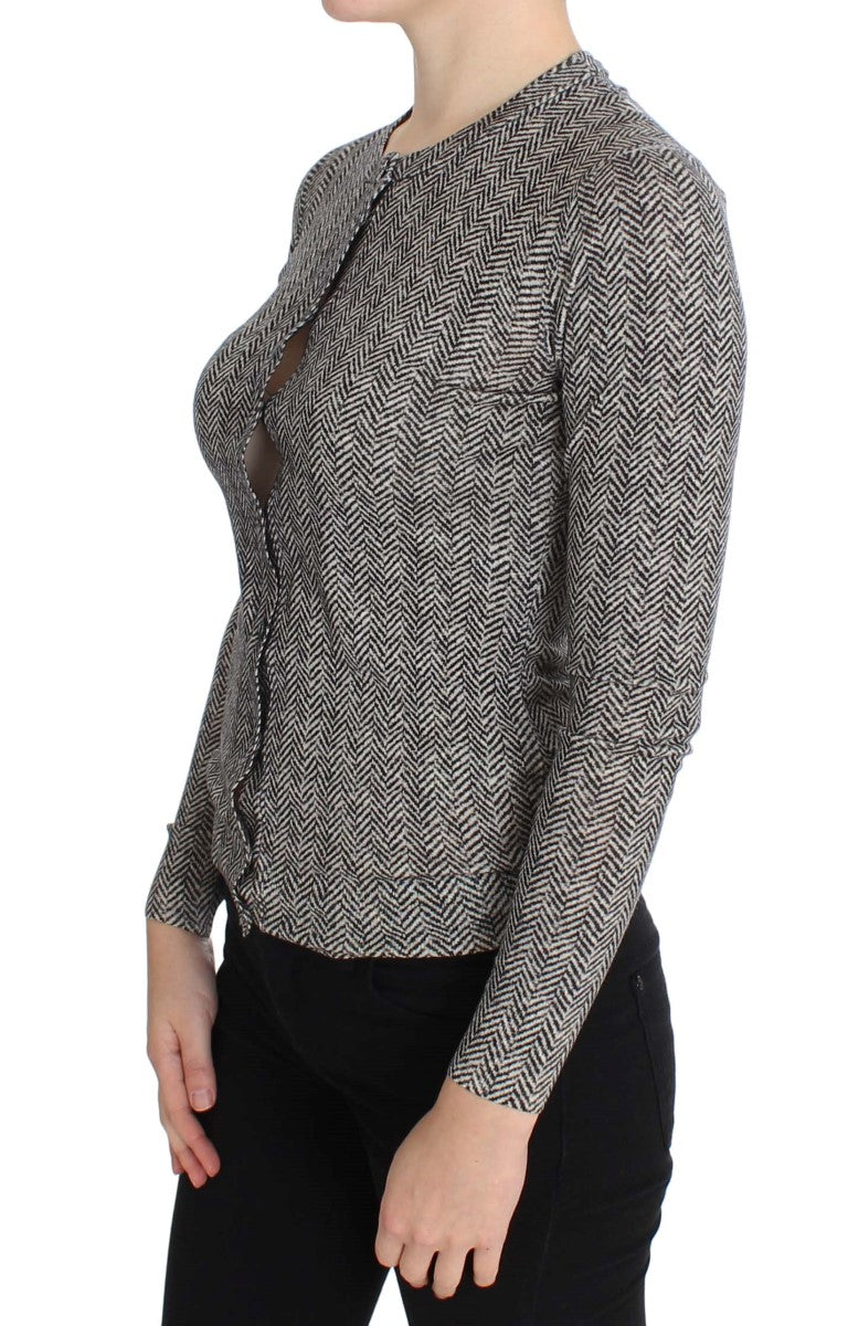 Woman wearing a black and white patterned top