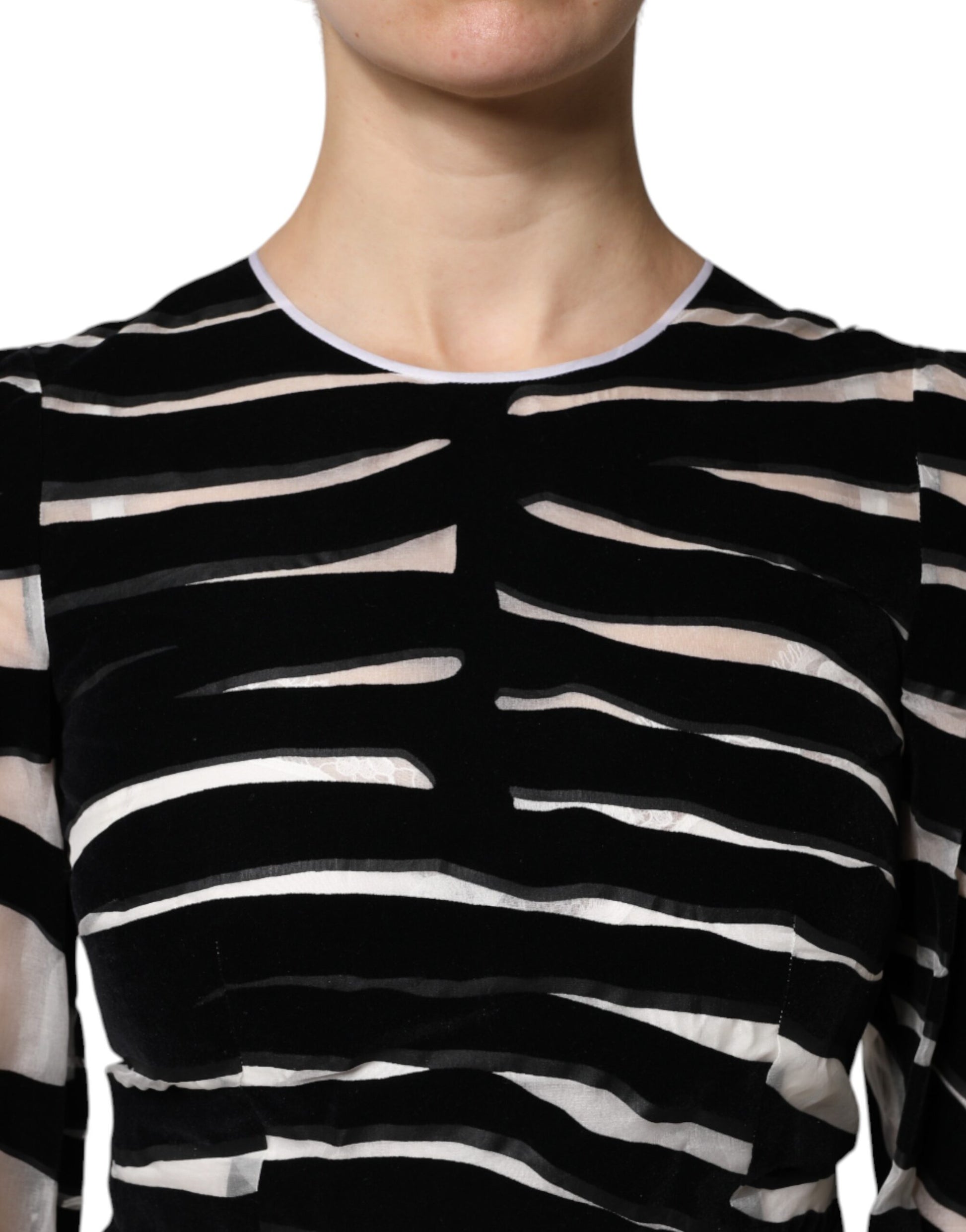 A black and white zebra print dress with an A-line silhouette. It features a sheath style design, suitable fo