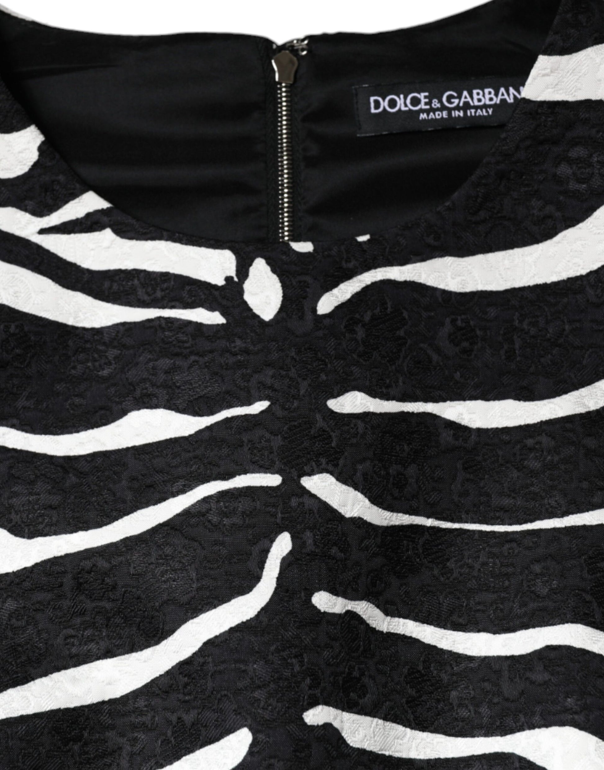A black and white zebra print dress with a zippered front