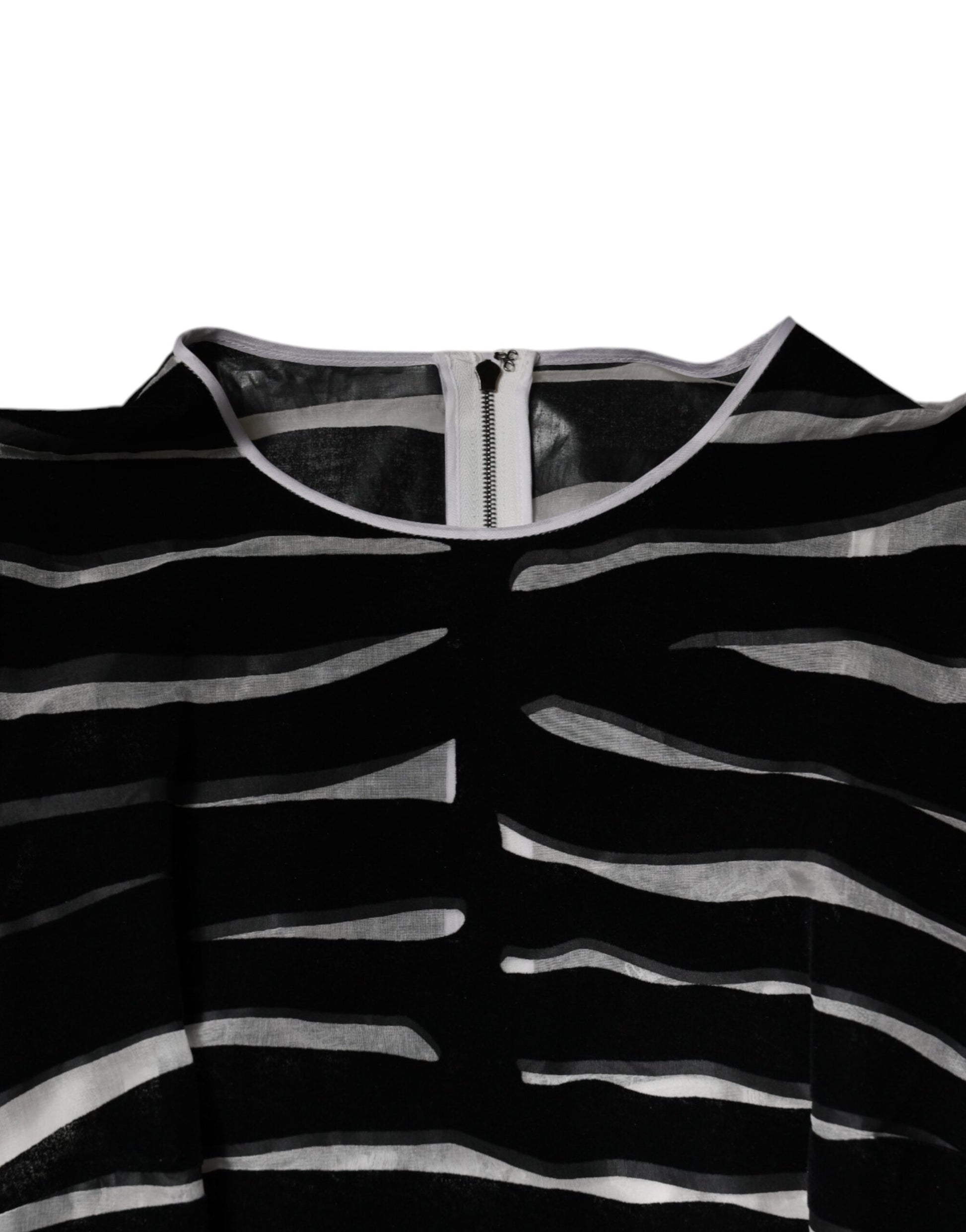 Black and white zebra print dress with A-line silhouette, featuring a sheath style