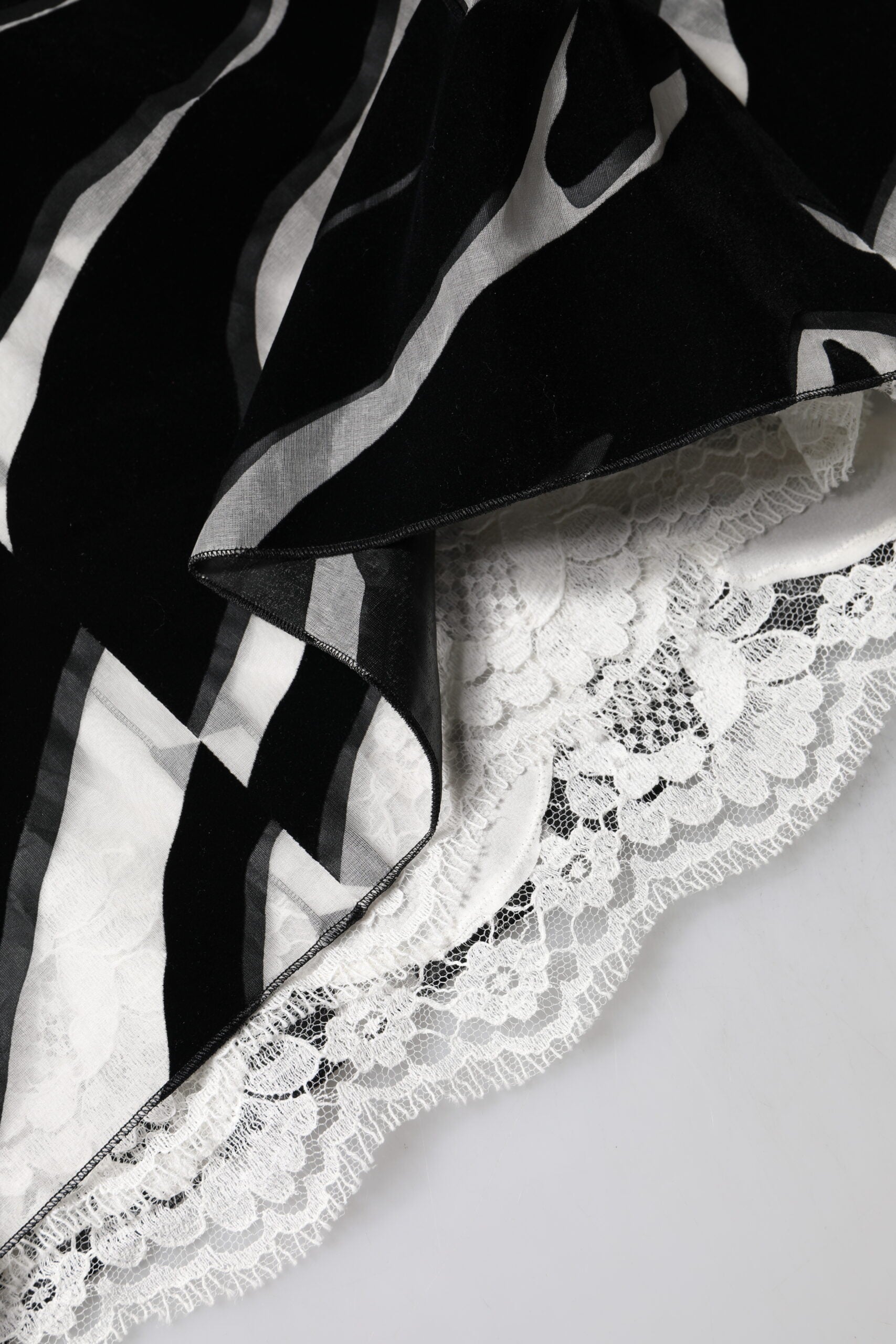 A black and white zebra print sheath dress with lace trim