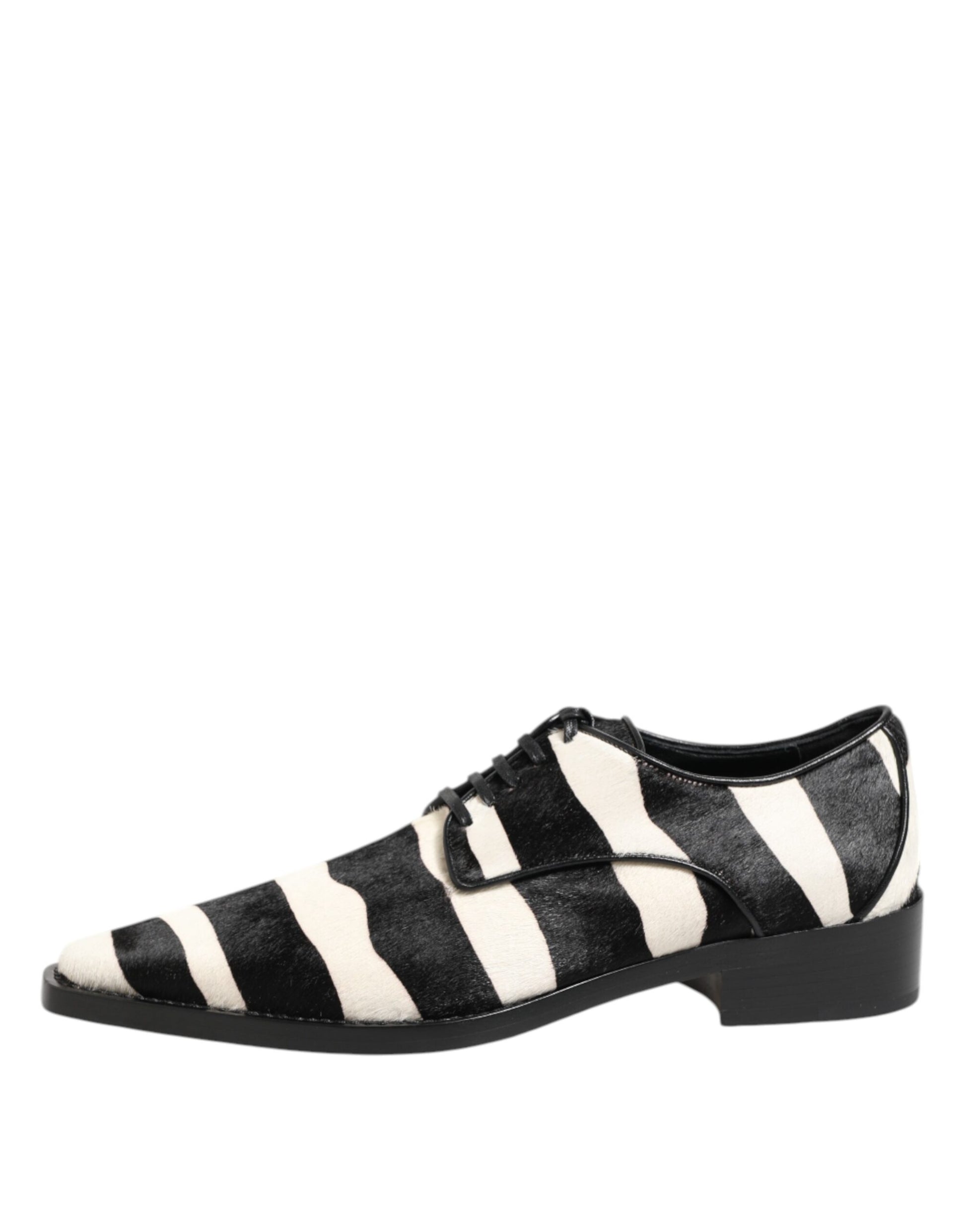A pair of black and white zebra print shoes with a fur trim