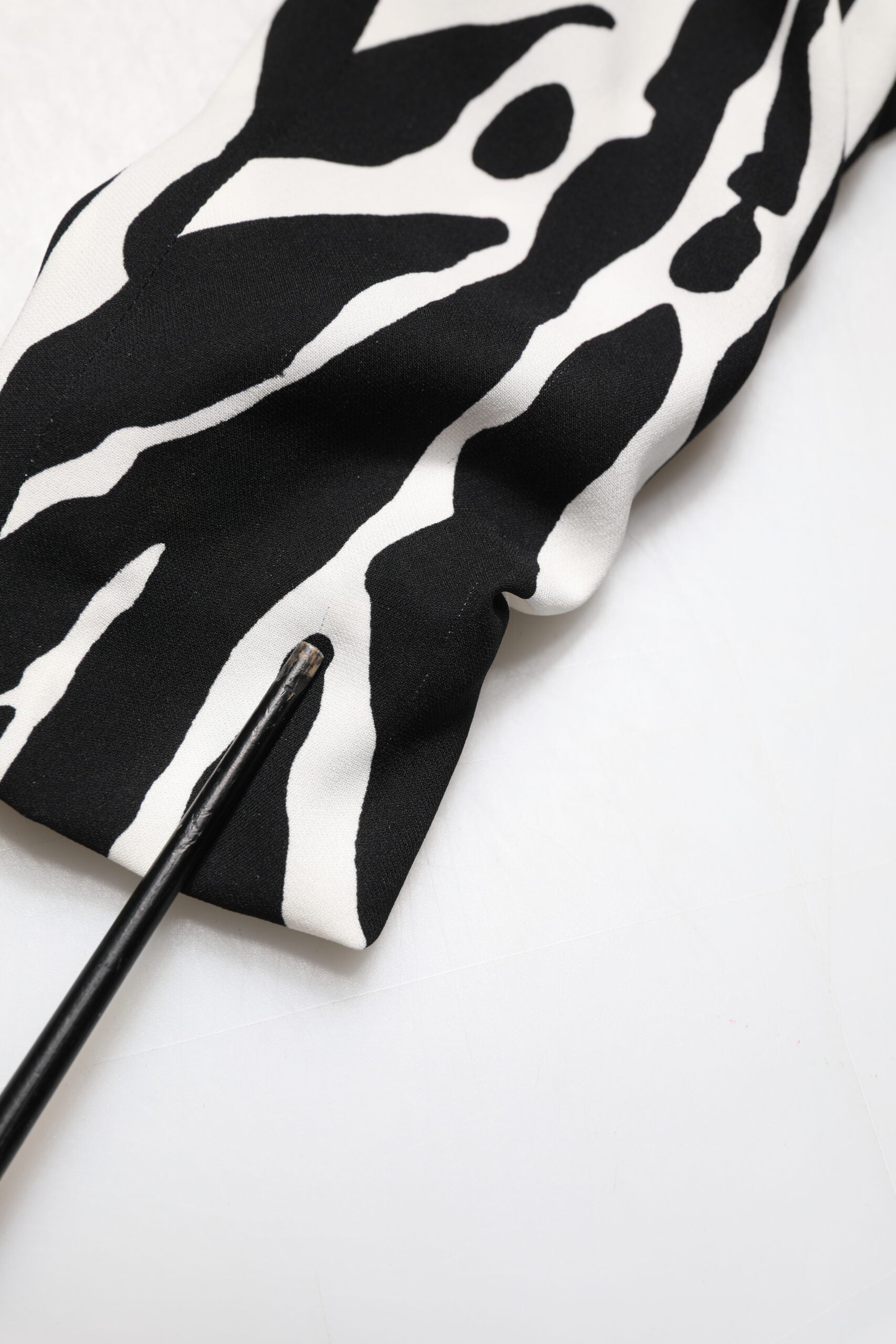 A black and white zebra print silk sheath mini dress