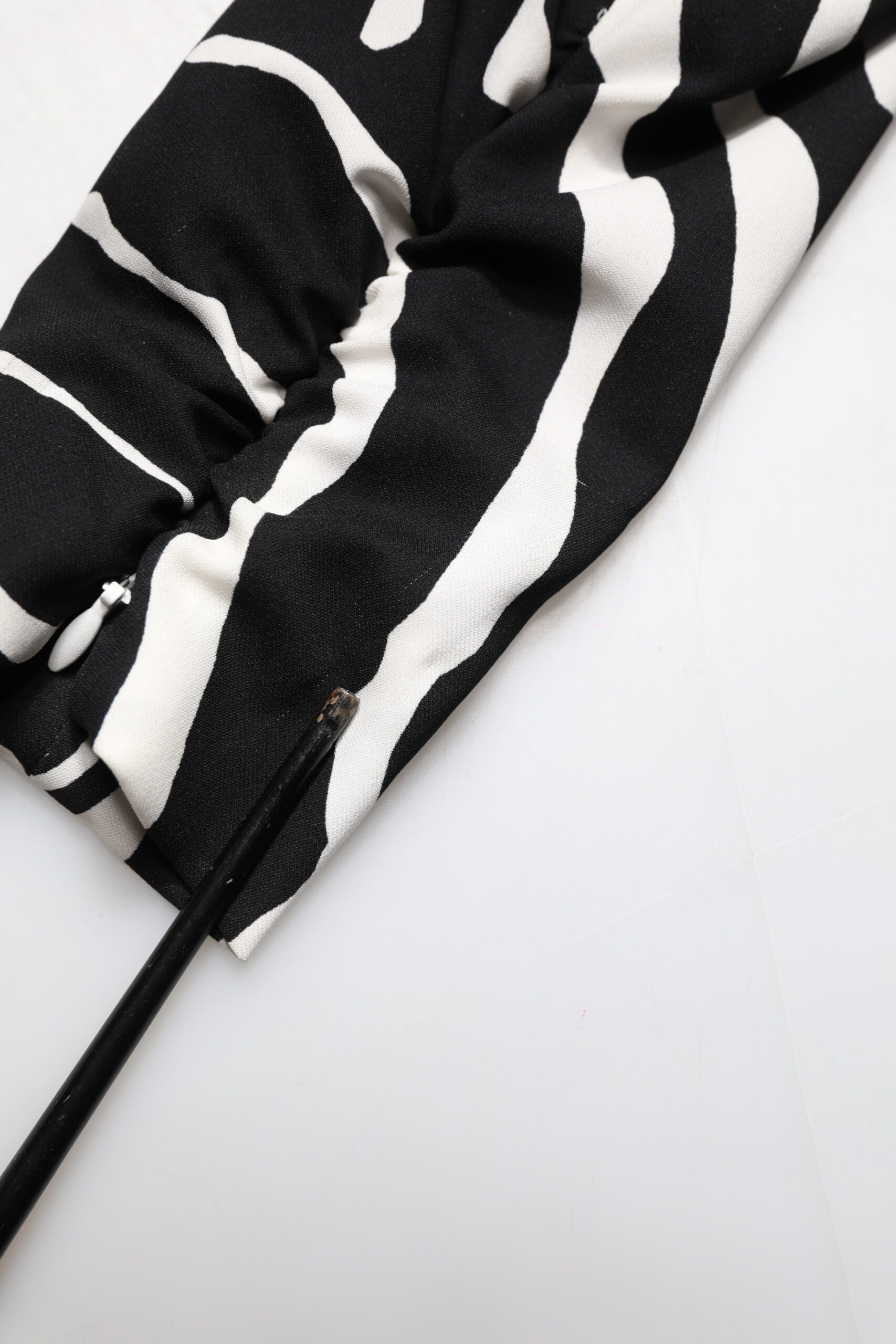 A black and white zebra print mini dress with a sheath silhouette