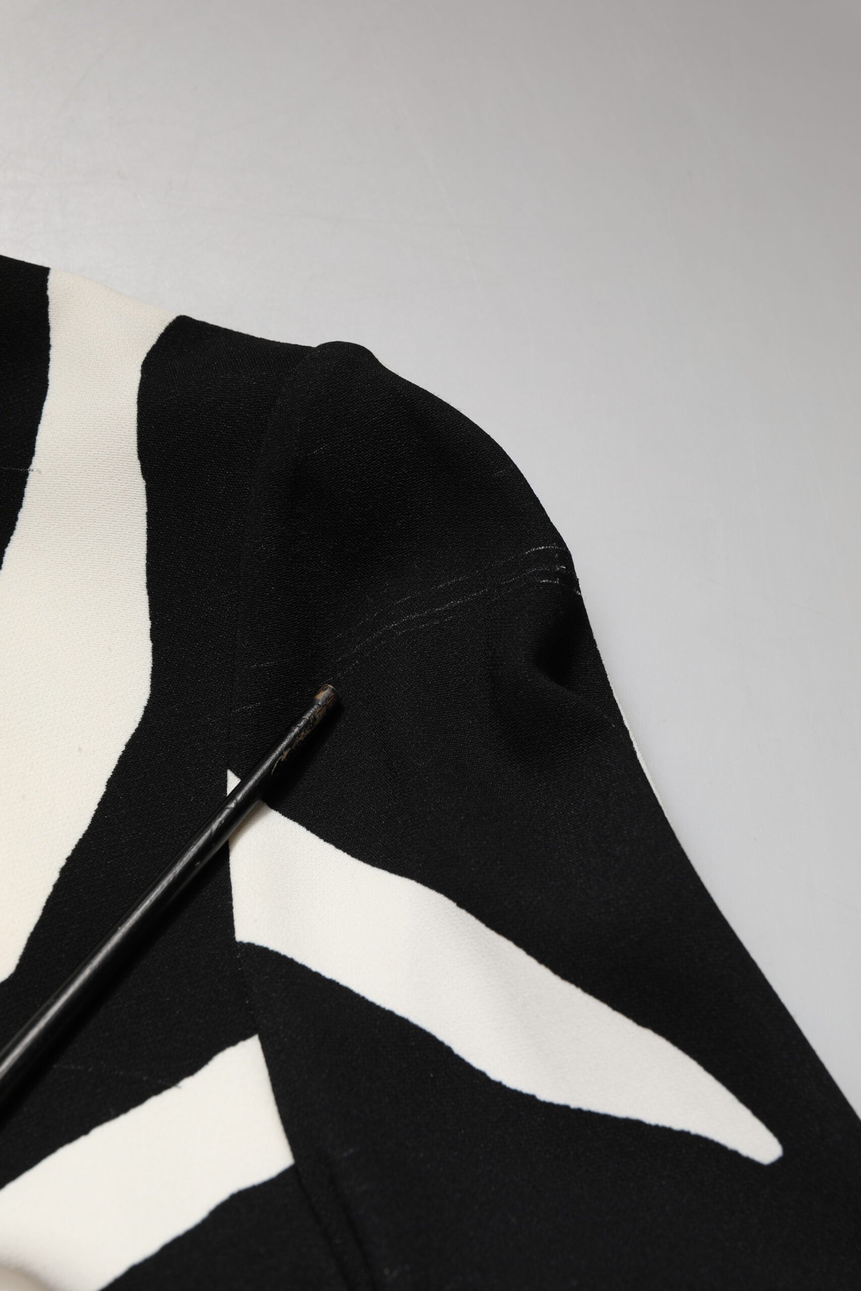 A black and white zebra print midi dress with a viscose fabric