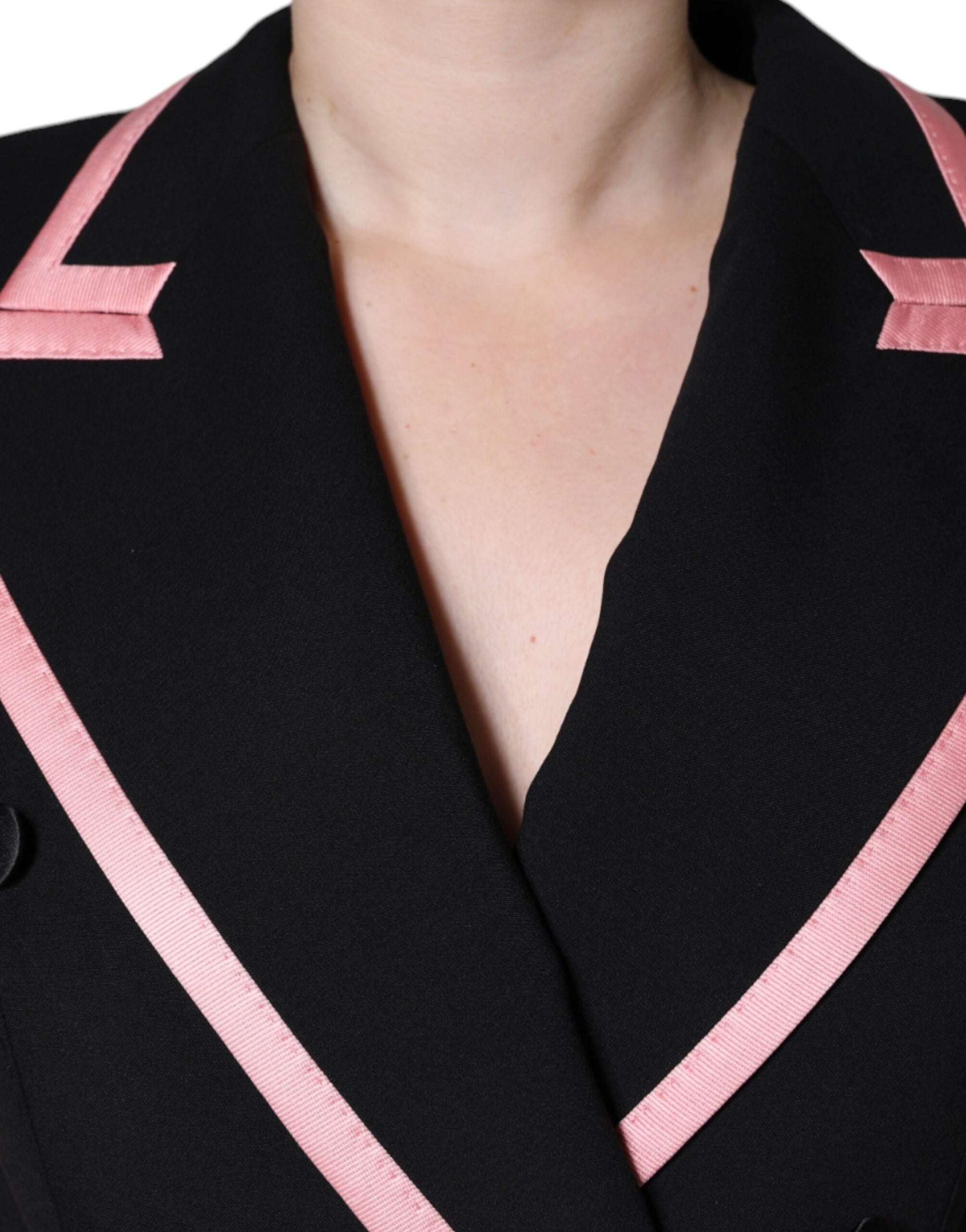A black wool blend sleeveless jumpsuit dress with pink accents