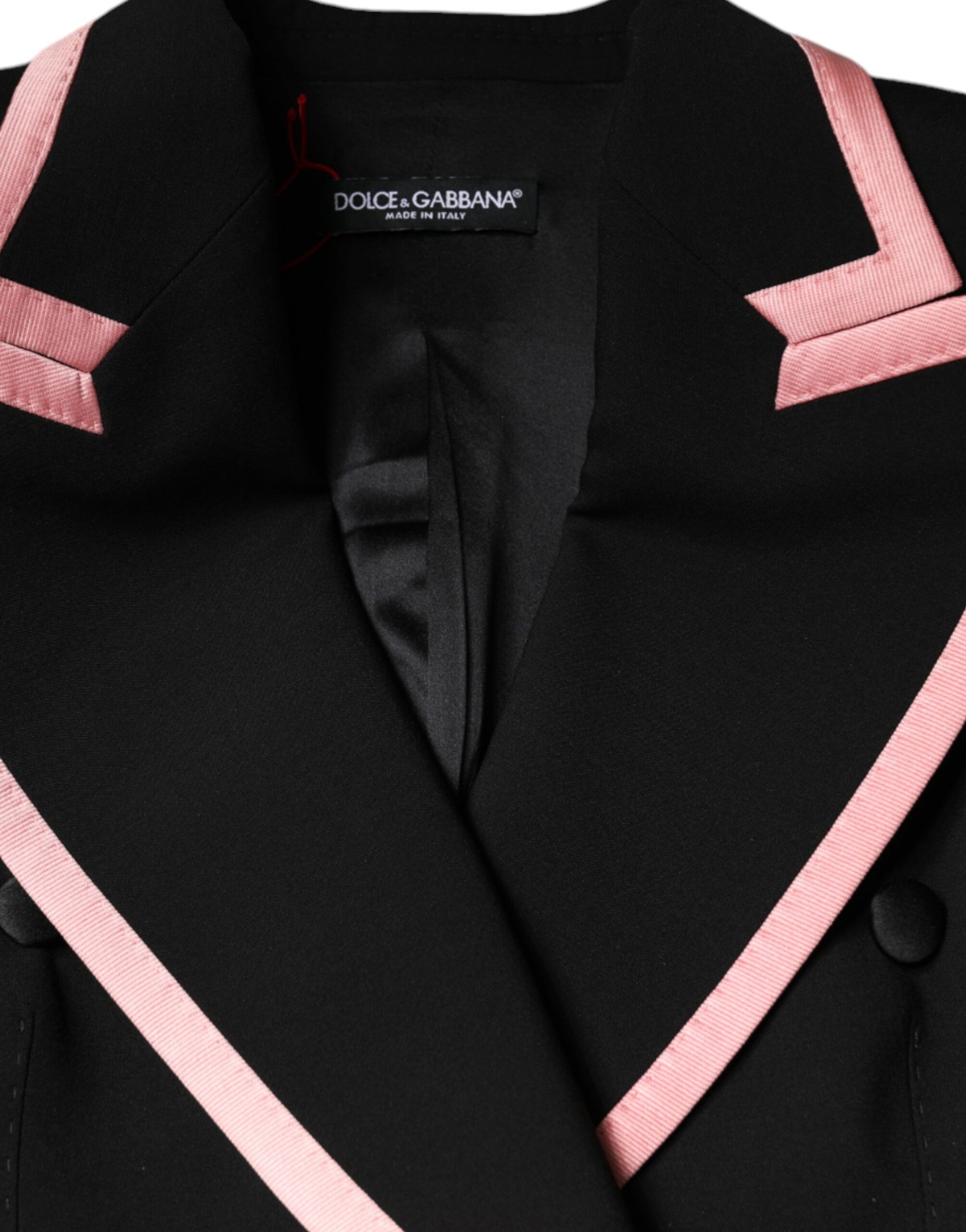 A black wool blend sleeveless jumpsuit dress with pink accents