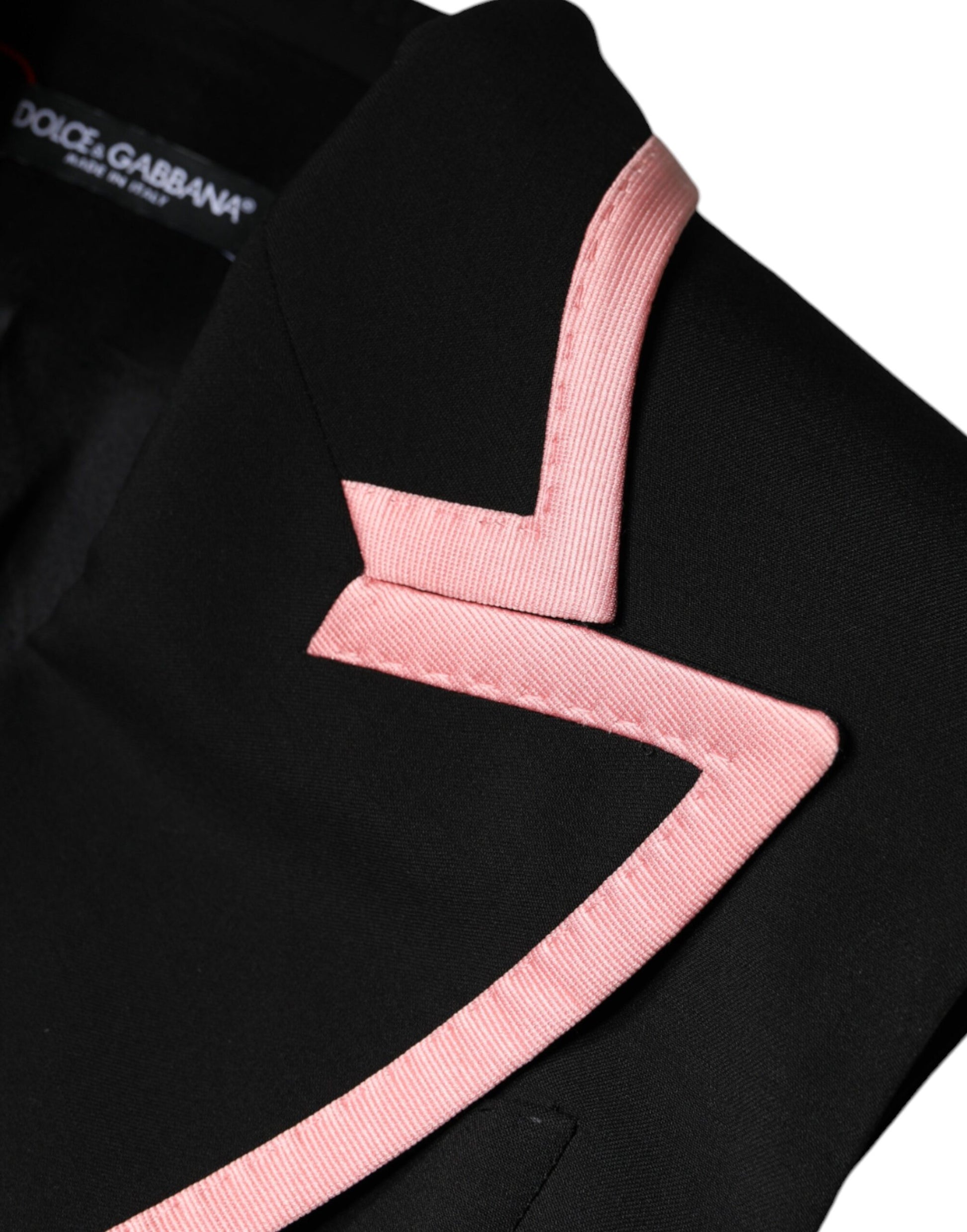 A black wool blend sleeveless jumpsuit dress with pink accents