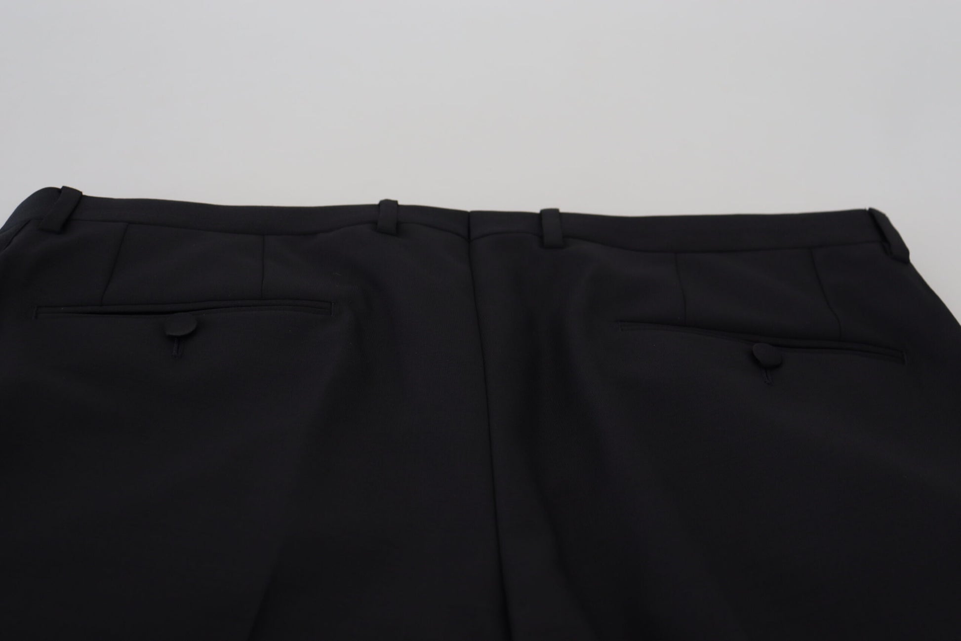 A pair of black wool chino dress pants by Dolce & Gabbana, featuring a slim fit and visible branding