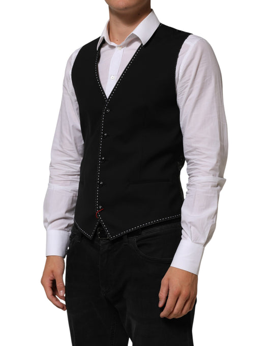 A black wool vest with a lapel and buttons, part of a formal men's suit