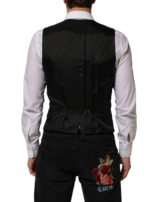 A black wool vest with a polka dot pattern, part of a formal men's suit
