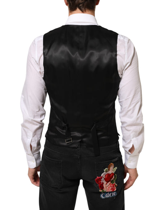 A black wool vest with a floral embroidered design on the back