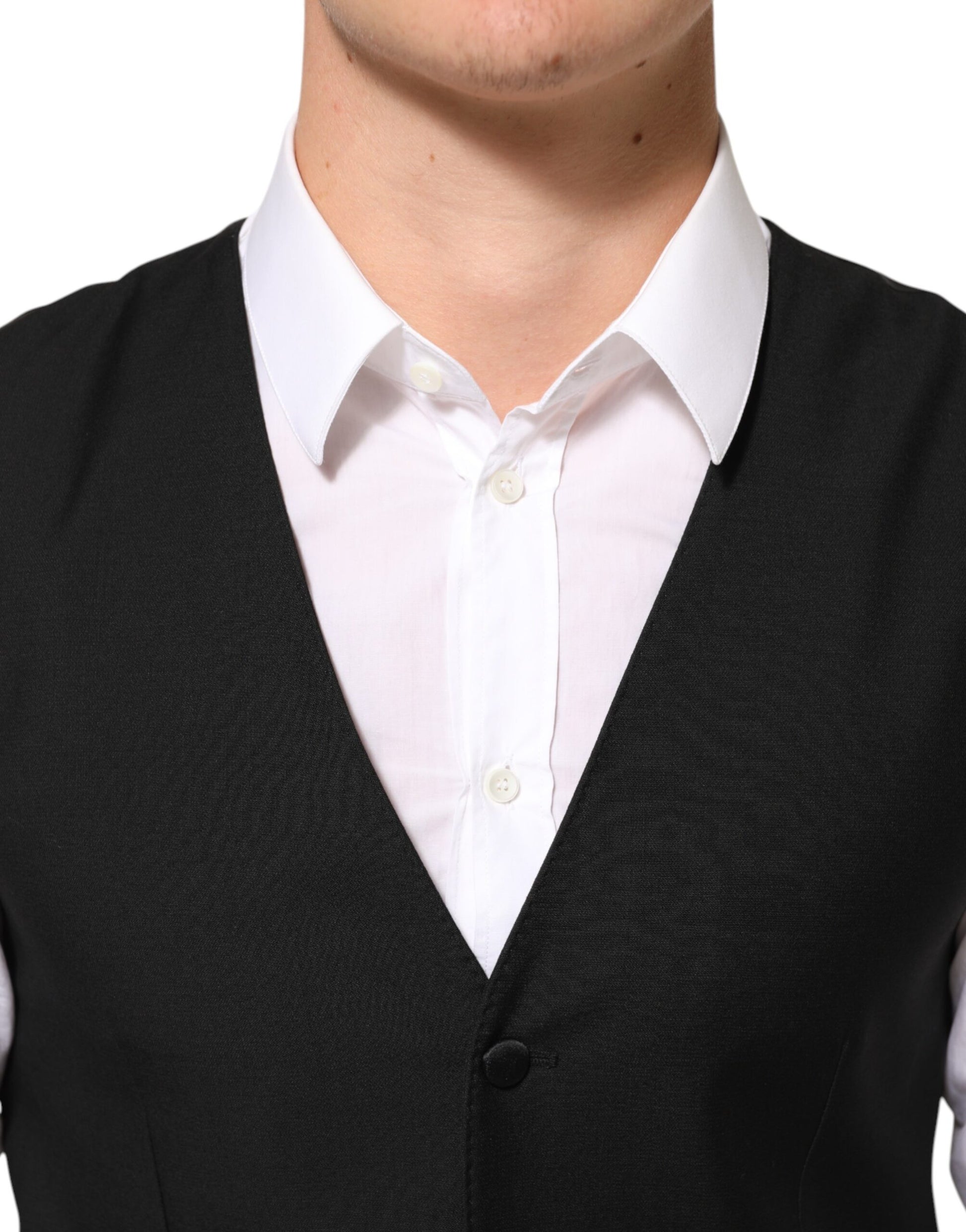 A black wool vest with a waistcoat, part of a formal men's suit