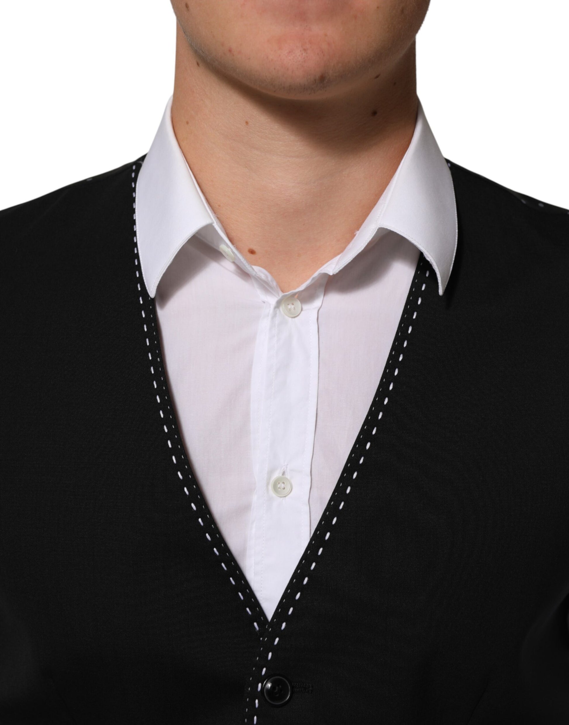 A black wool vest with a white shirt underneath