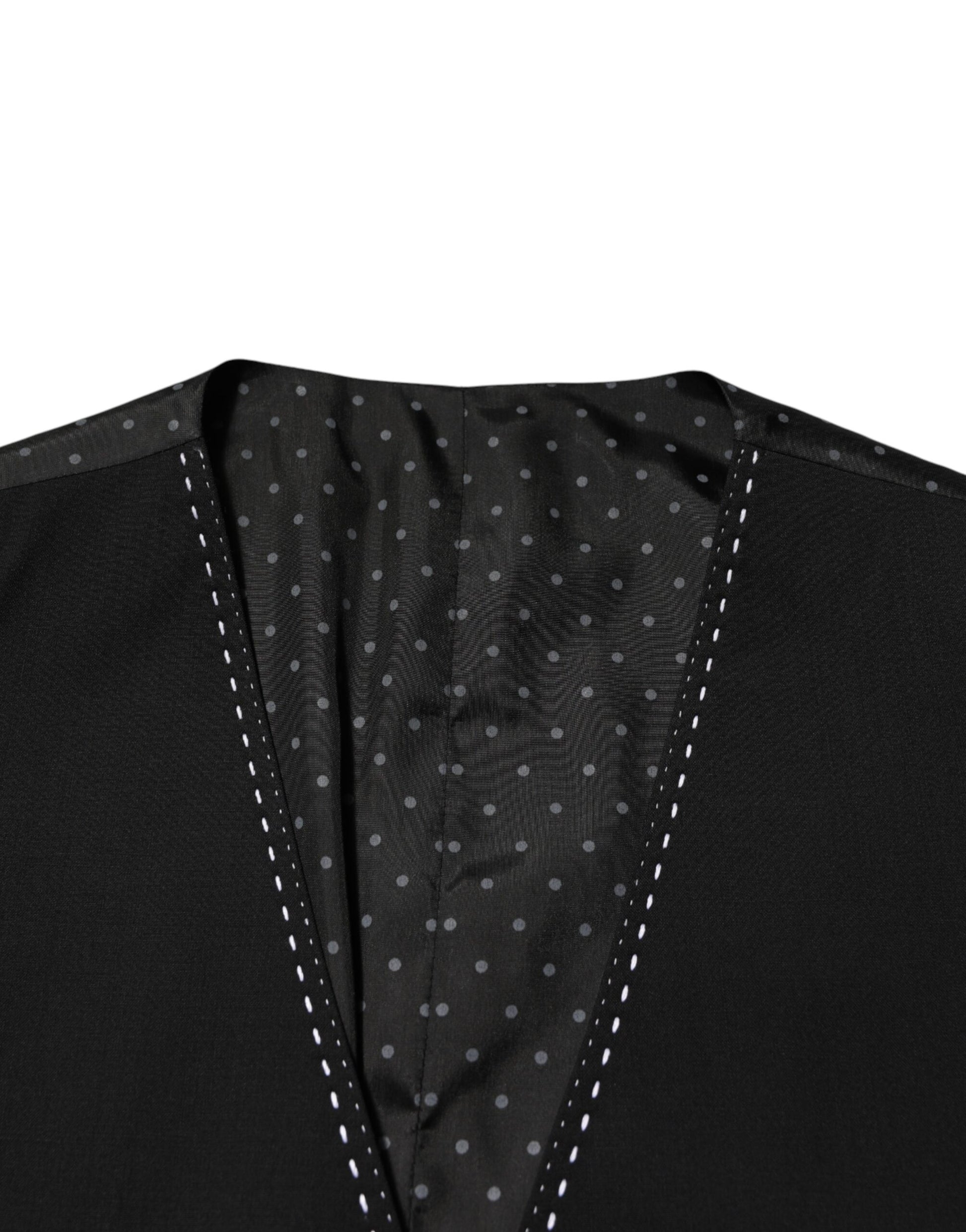 A black wool vest with polka dots, part of a formal men's suit