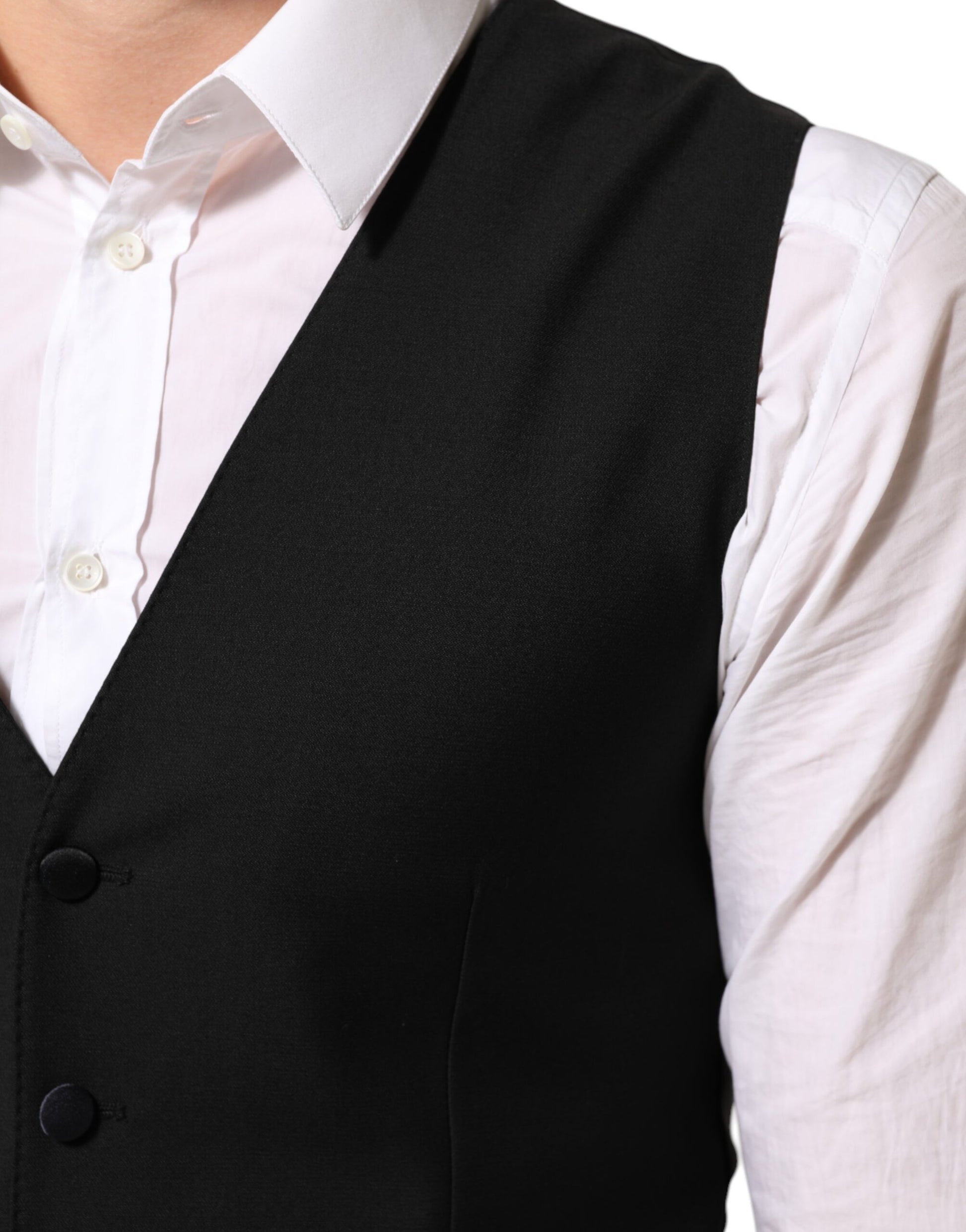 A black wool vest with a waistcoat, part of a formal men's suit