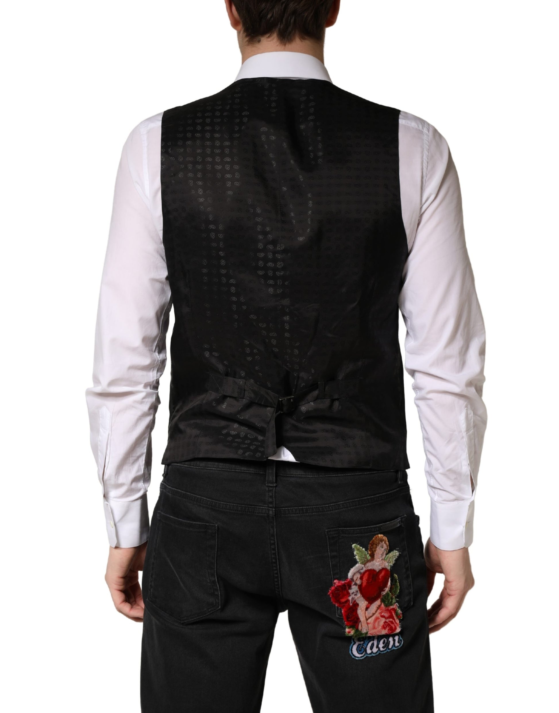 A black wool vest with a floral embroidered design on the back