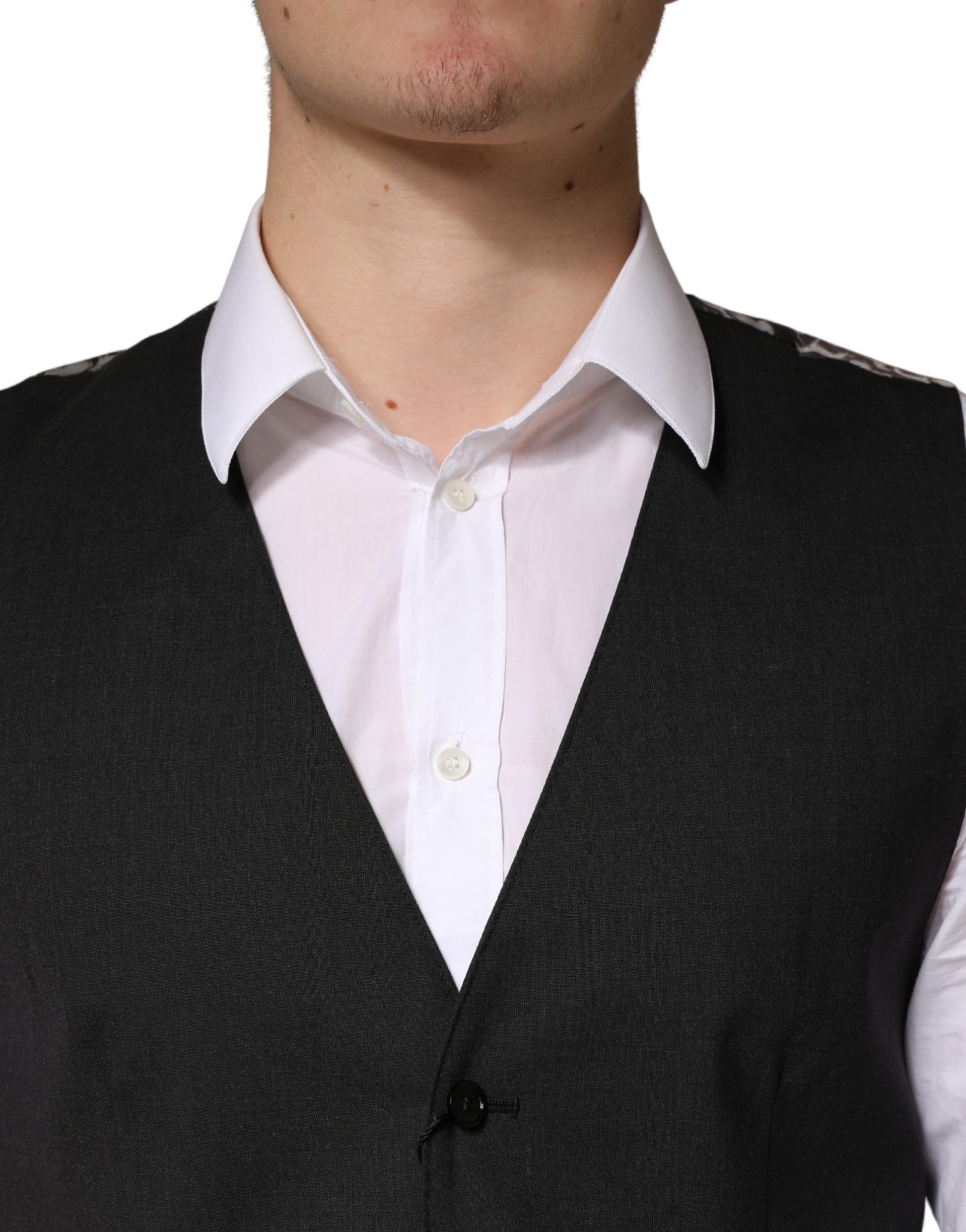 A black wool vest with a waistcoat, part of a formal men's suit