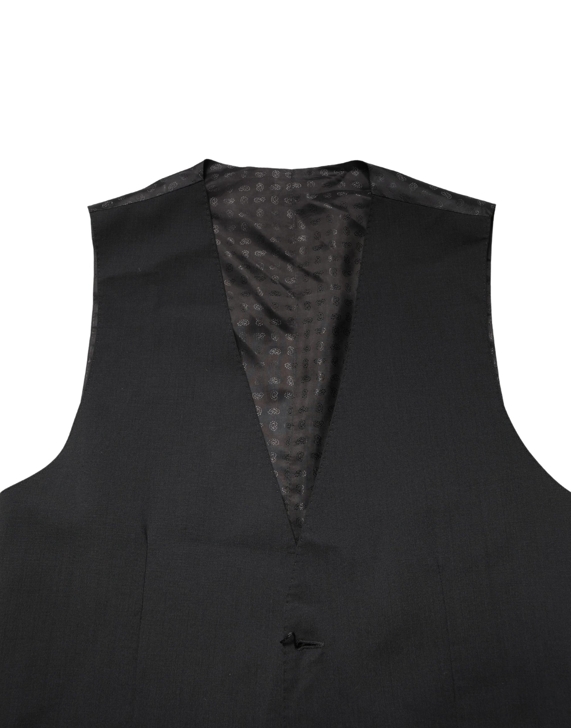 A black wool vest with a polka dot pattern on the inside