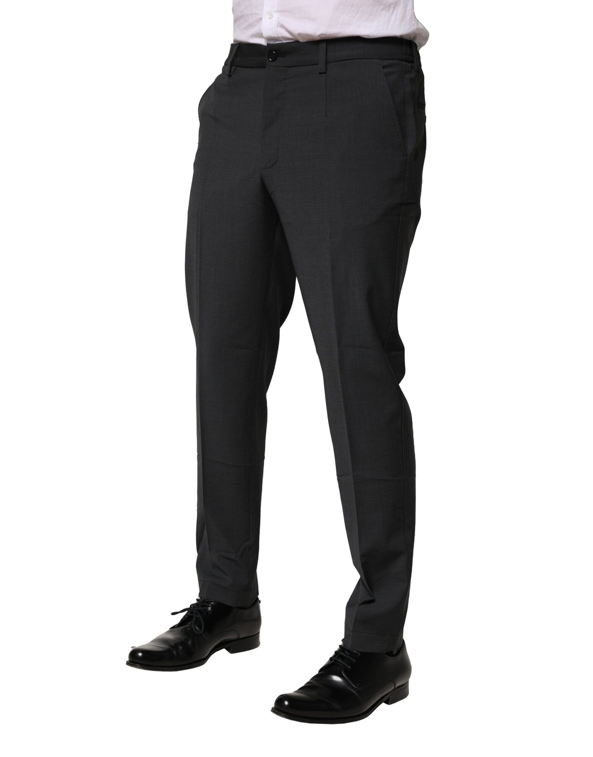 A pair of black wool dress pants from Dolce & Gabbana, featuring a slim fit and formal design