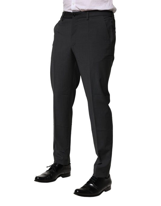 A pair of black wool dress pants from Dolce & Gabbana, featuring a slim fit and formal design