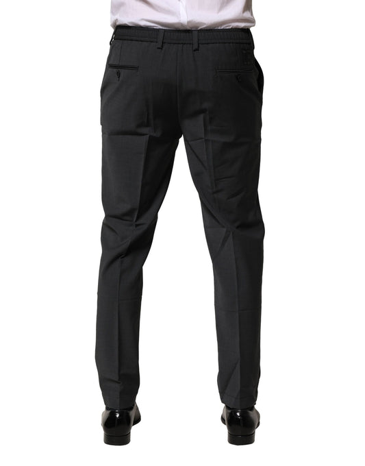 A pair of black wool dress pants from Dolce & Gabbana, featuring a slim fit and formal design