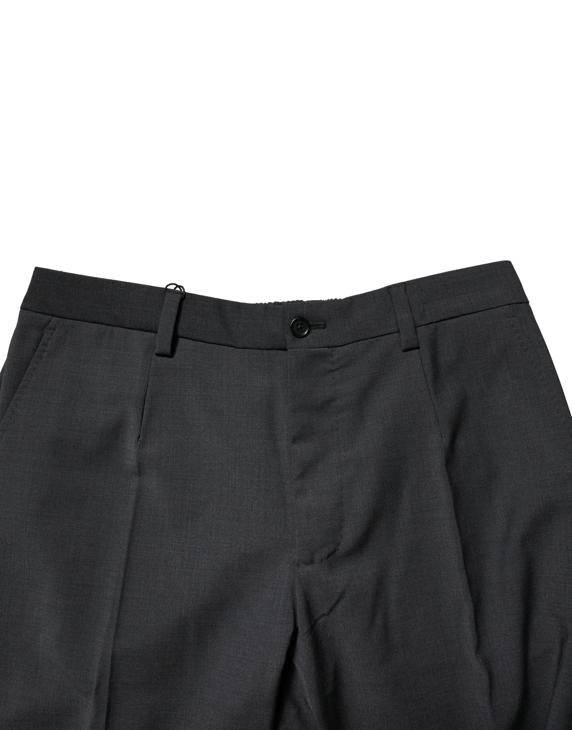 A pair of black wool dress pants from the brand Dolce & Gabbana. They are slim-fitting and appear to be forma