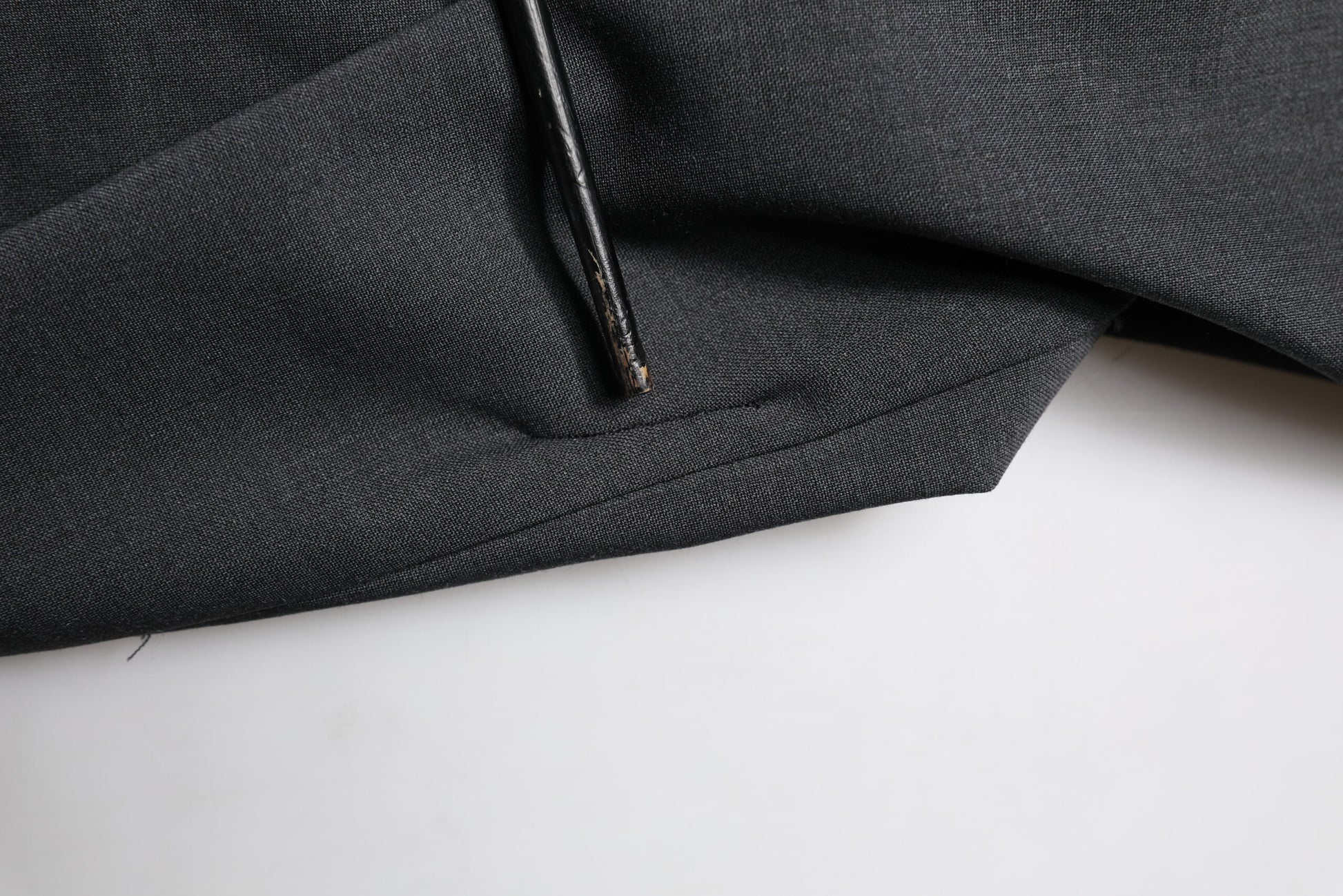 A black wool dress with slim fit formal pants