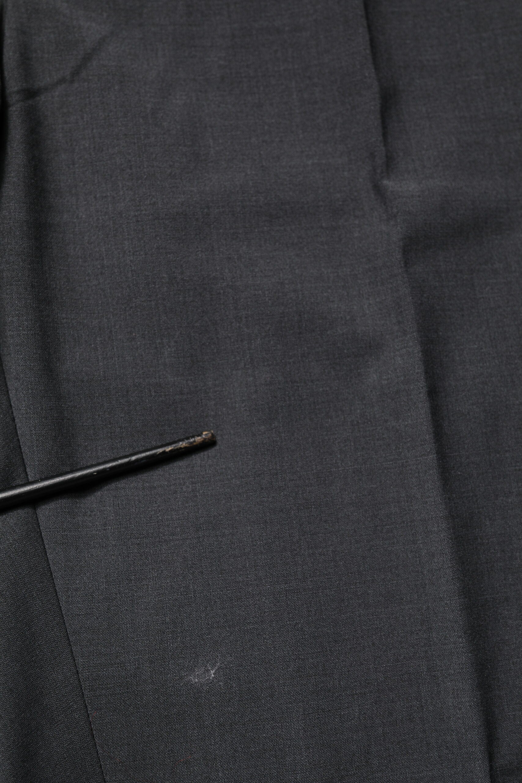 A black wool dress pant from Dolce & Gabbana, featuring a slim fit and formal design