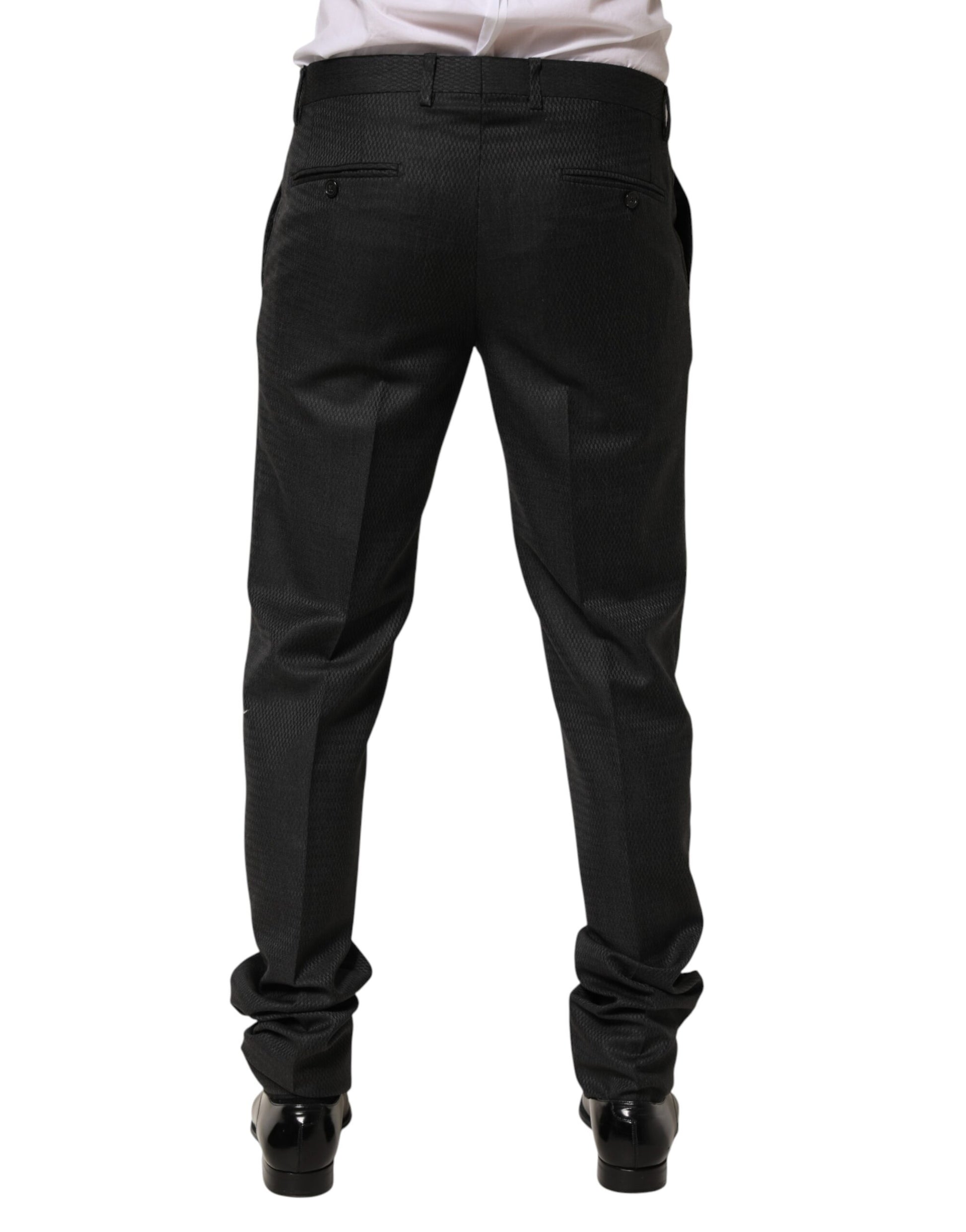 A pair of black wool formal dress pants from the brand Dolce & Gabbana. They are designed for men and feature