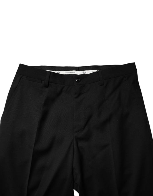 A pair of black wool formal dress men's trousers with a visible waistband and button closure