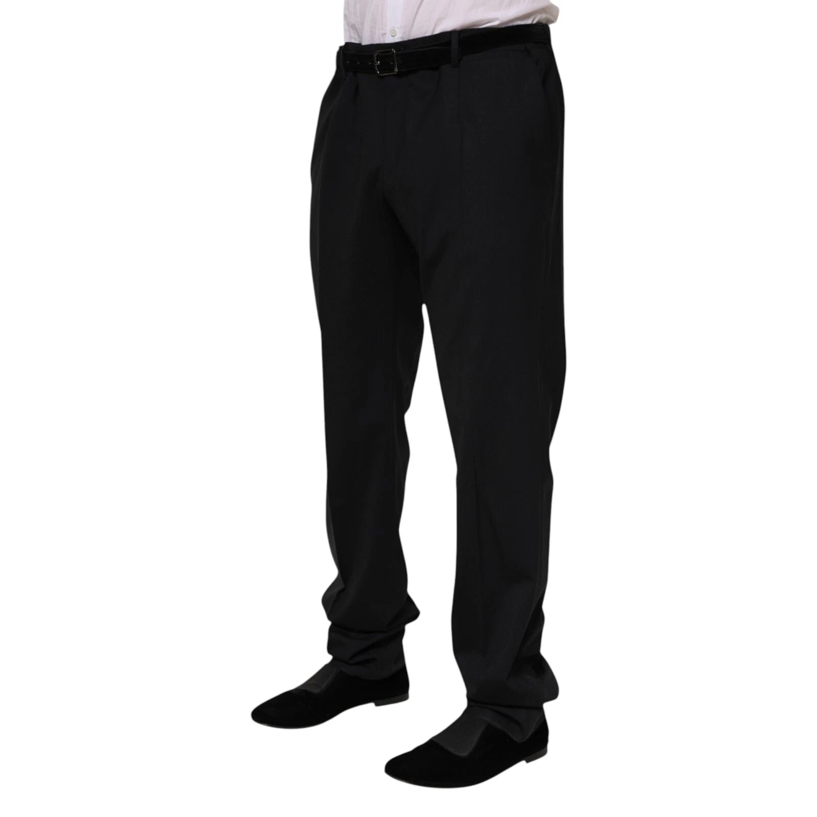 Man wearing black suit pants and shoes
