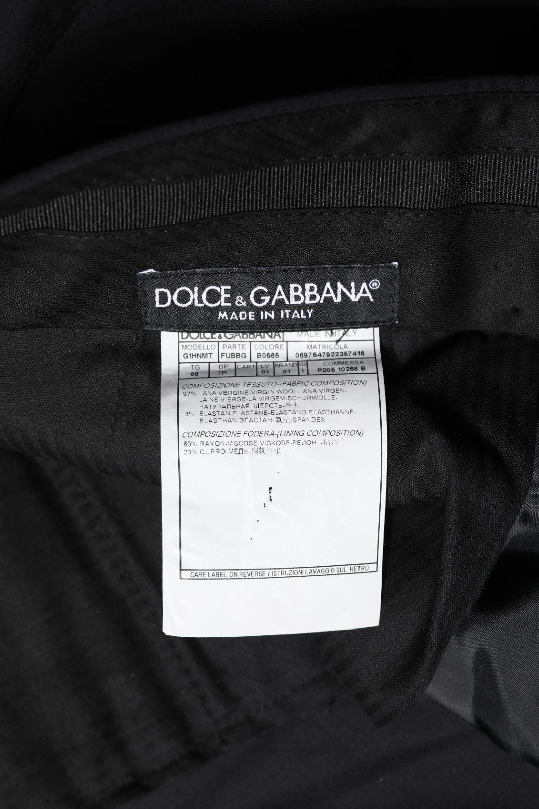 Black bag with white label reading "dolce & gabbana made in italy"