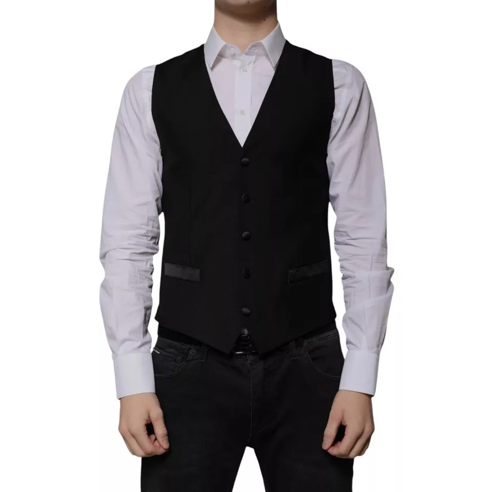 A black wool vest with a waistcoat, part of a formal dress for men