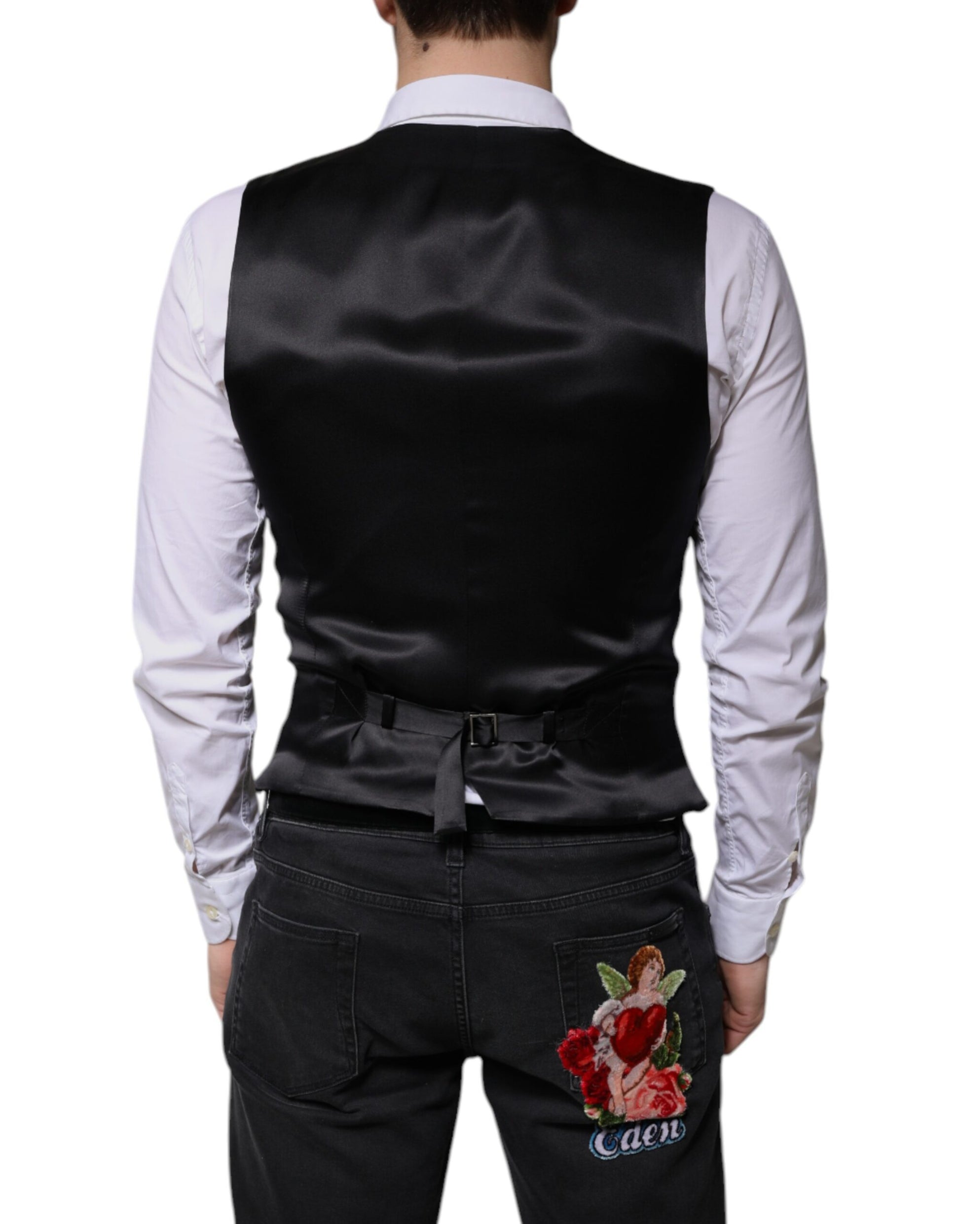 A black wool vest with a lapel and a rose embroidered on the back