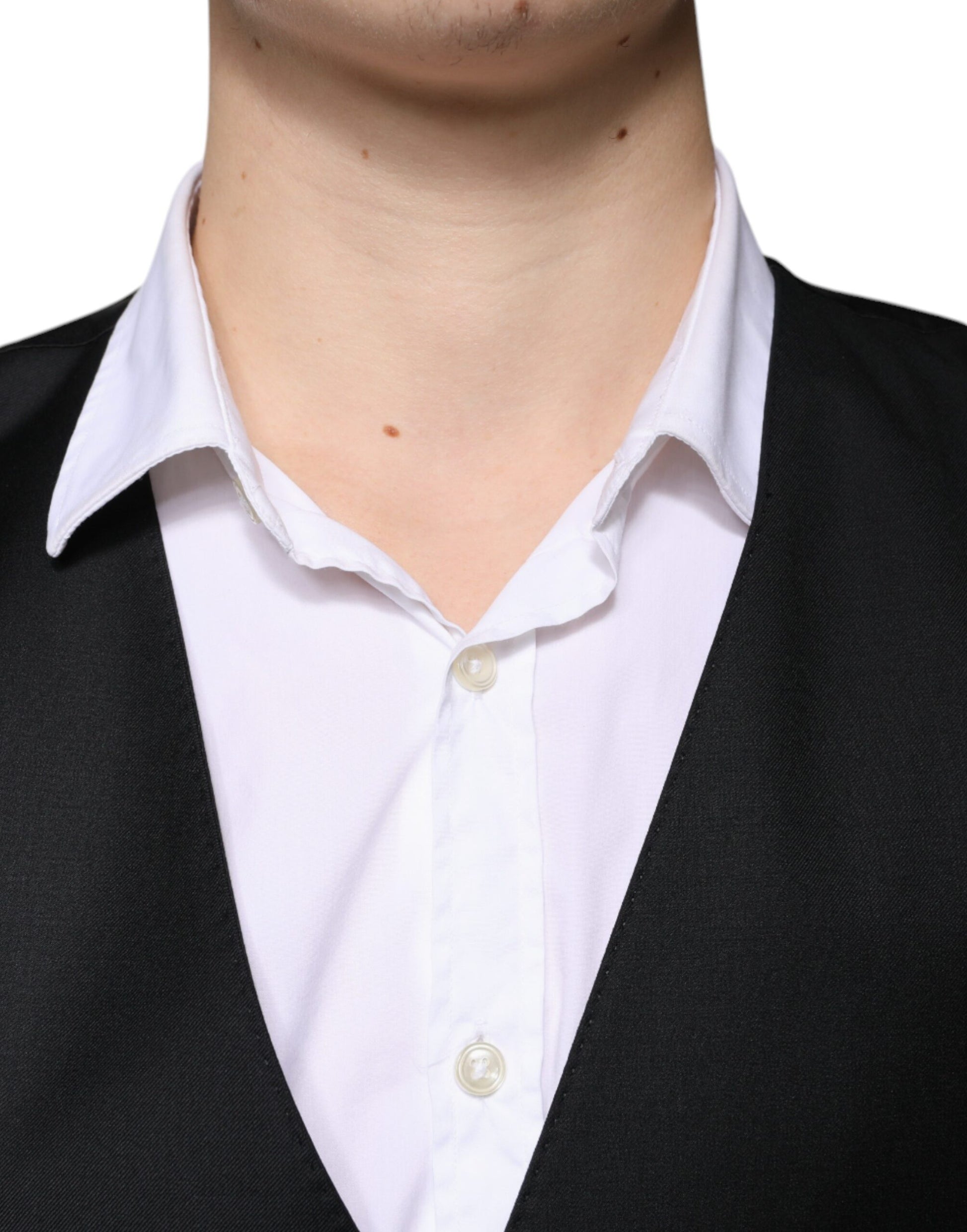 A black wool vest with a white shirt underneath