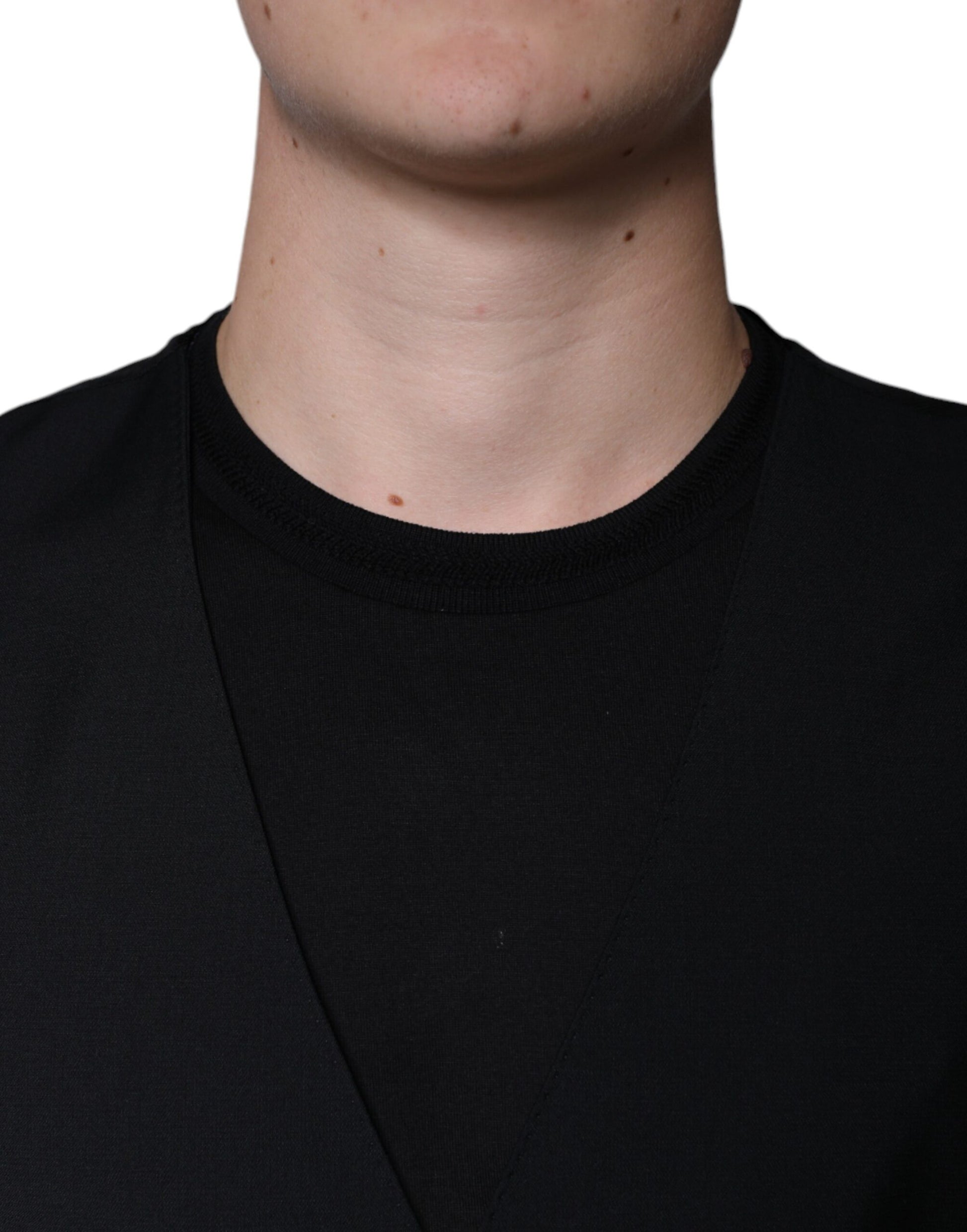 A black wool vest with a ribbed neckline and waistband
