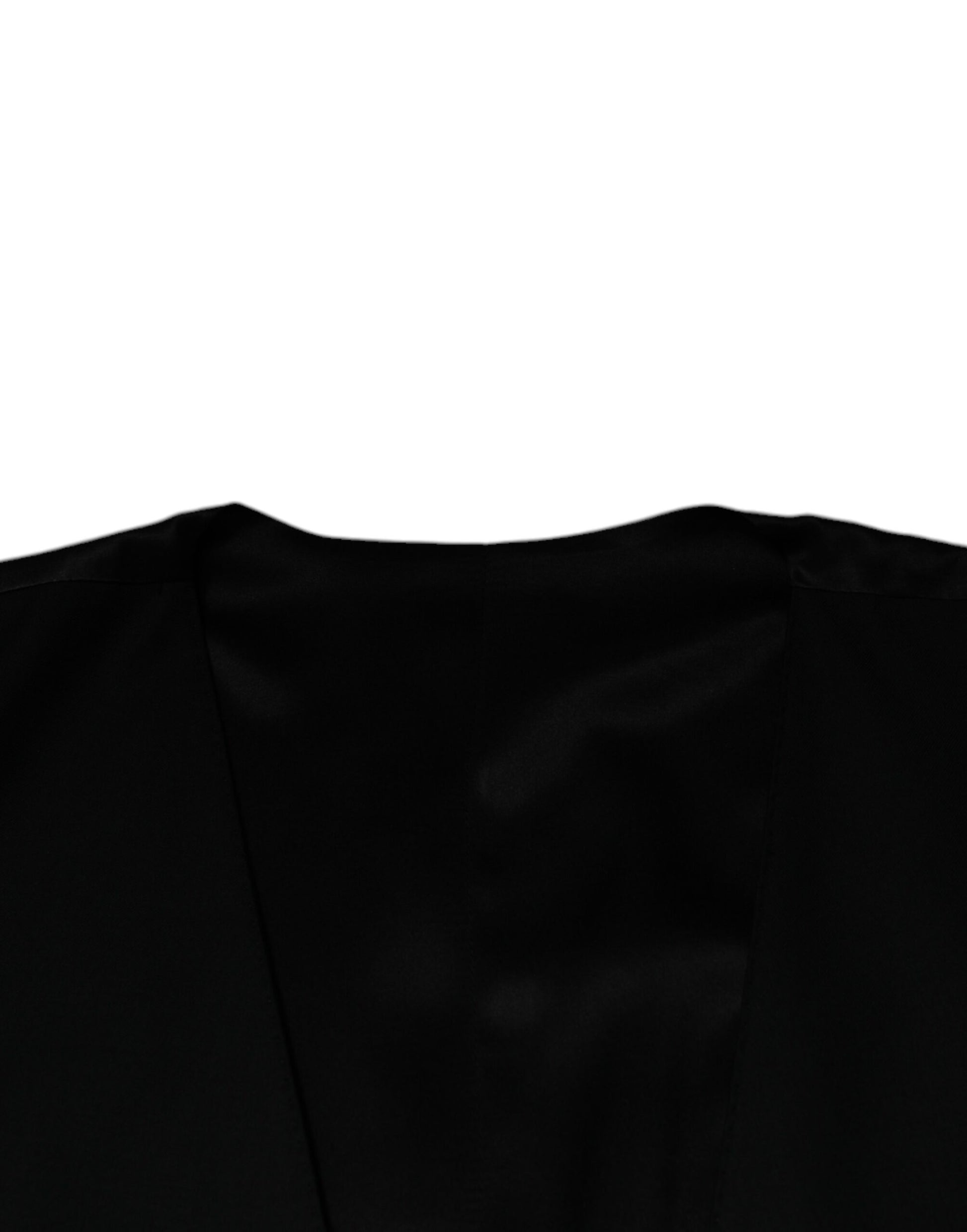 A black wool vest from Dolce & Gabbana, part of a formal dress for men