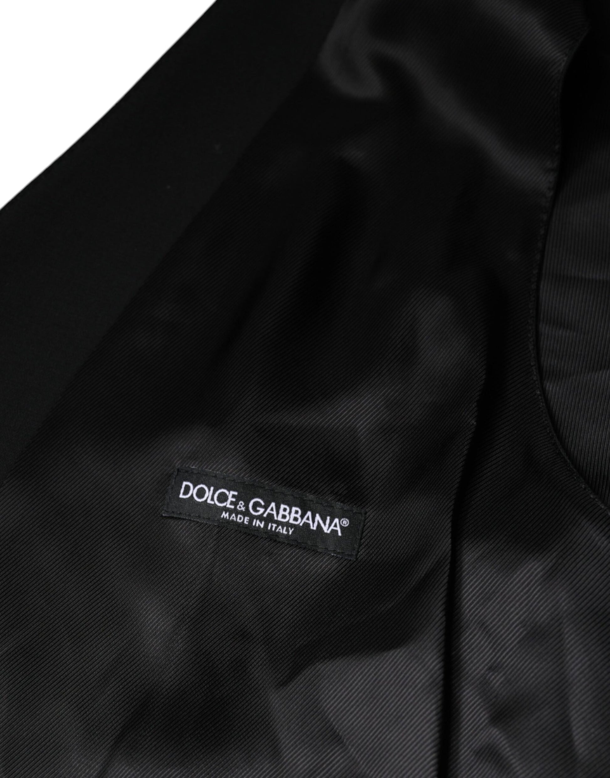 A black wool vest from Dolce & Gabbana, featuring the brand's logo